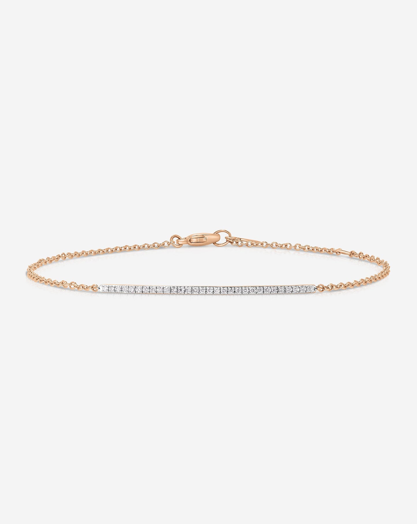 Flat lay image of 14k Rose Gold Diamond Bar Bracelet