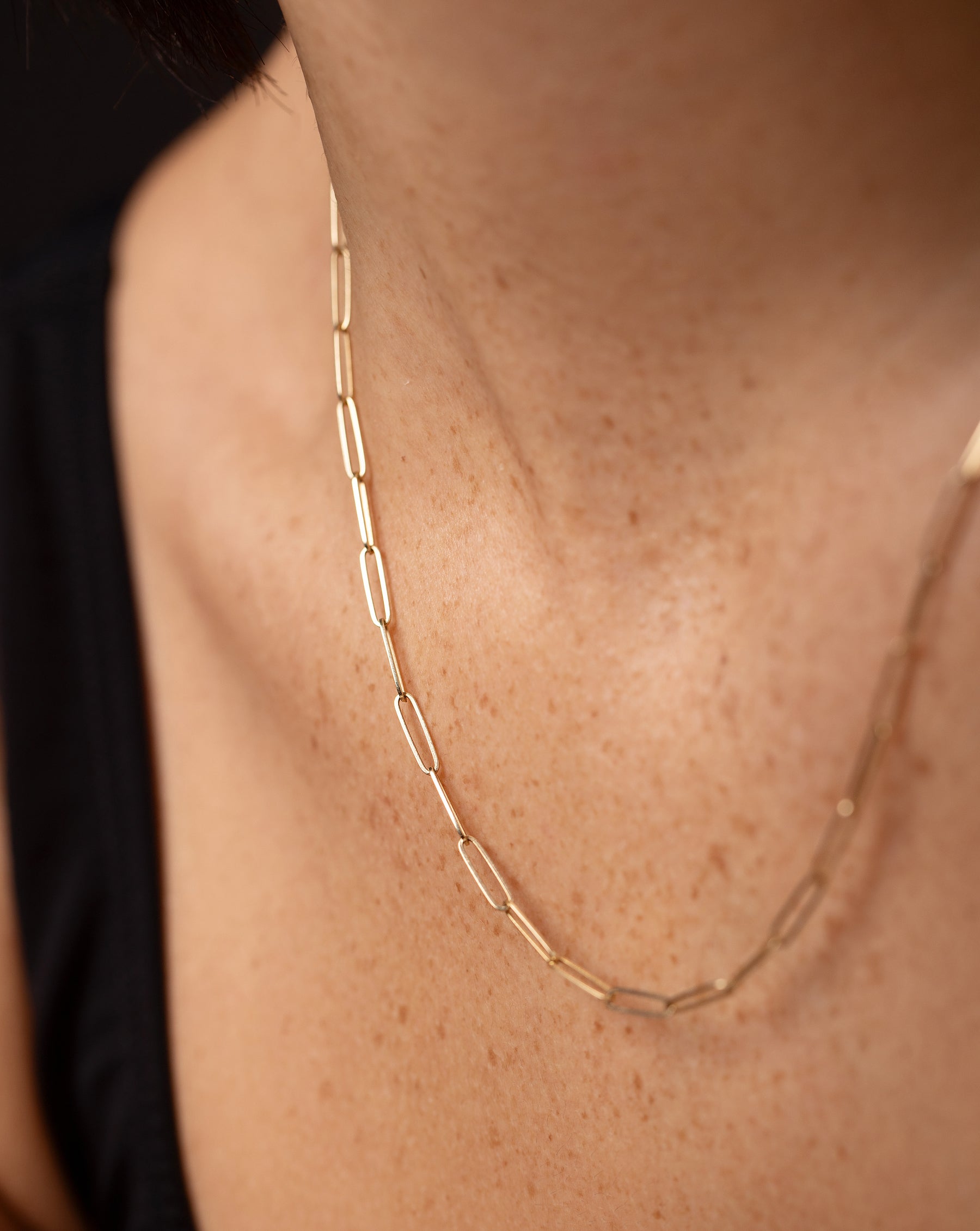 14k yellow gold small link necklace shown on model