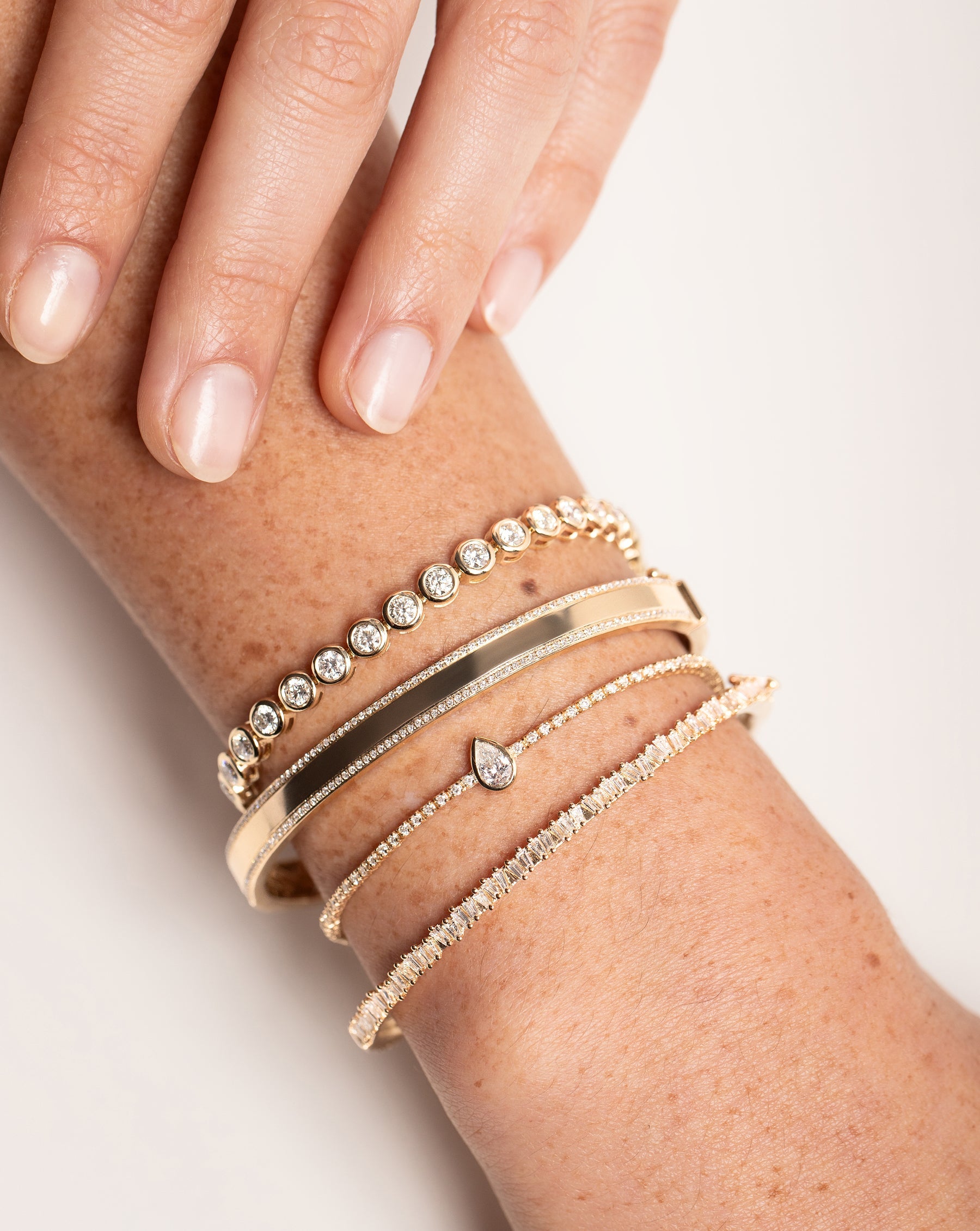 Diamond Border Bangle styled with 3 other bracelets