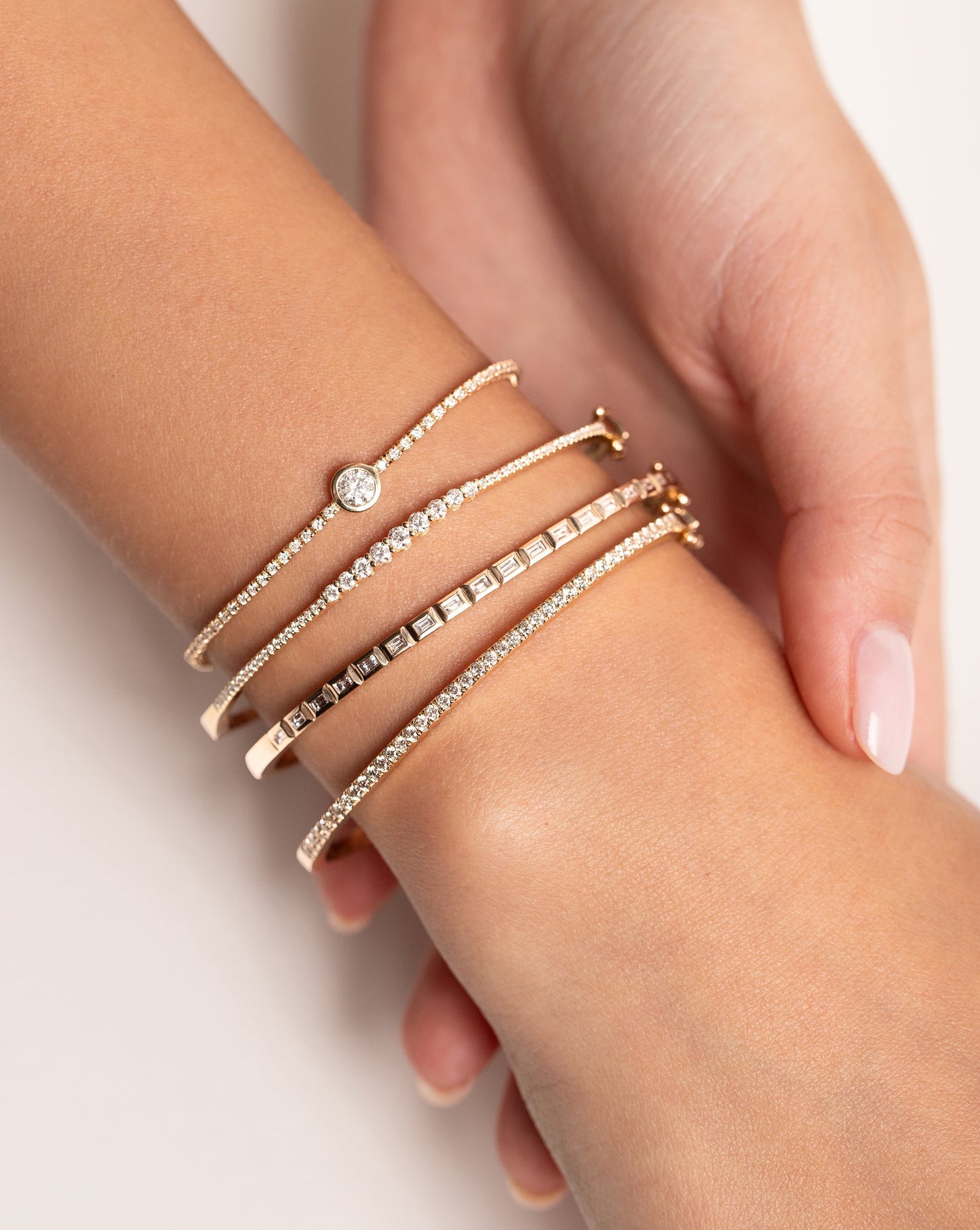 Baguette Bezel Bangle styled with 3 other Ring Conciegre bracelets