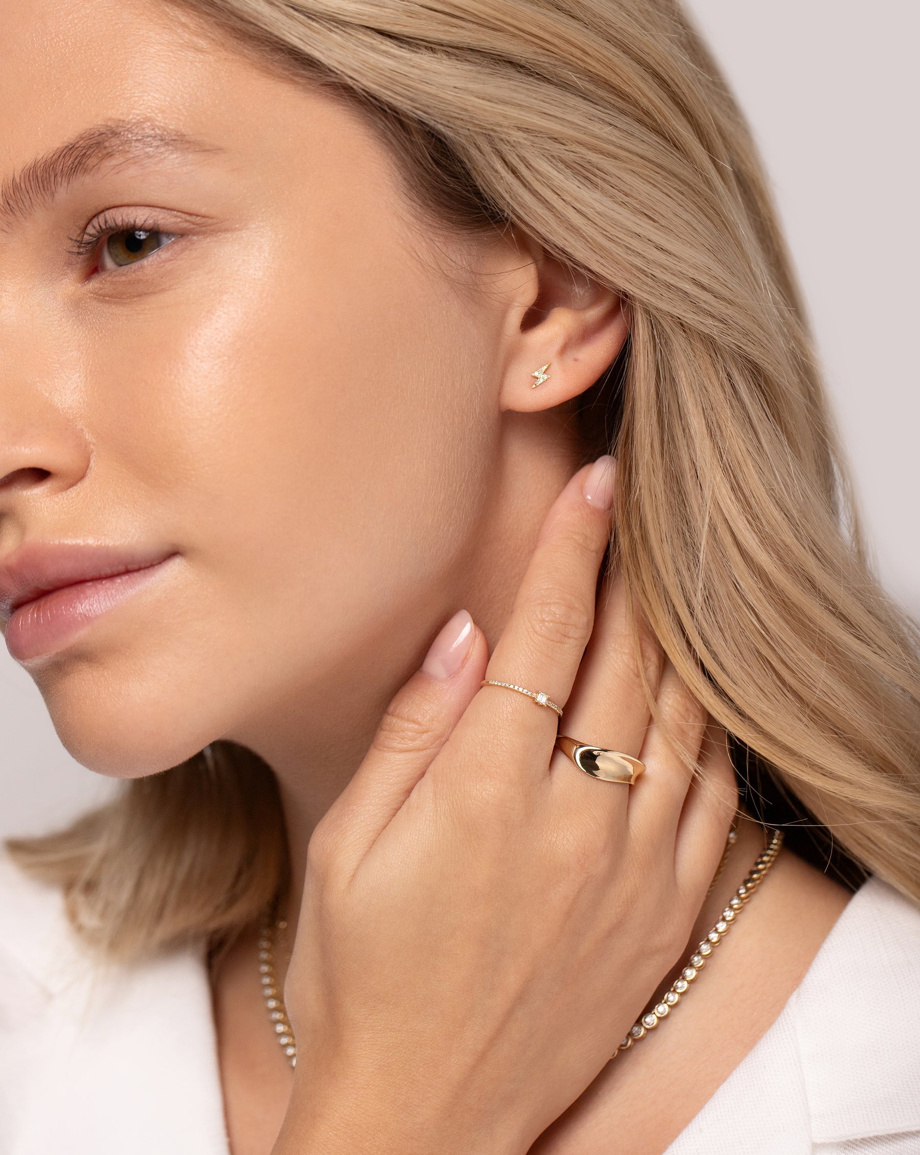 Model wear Ring Concierge earring, 2 rings and necklace