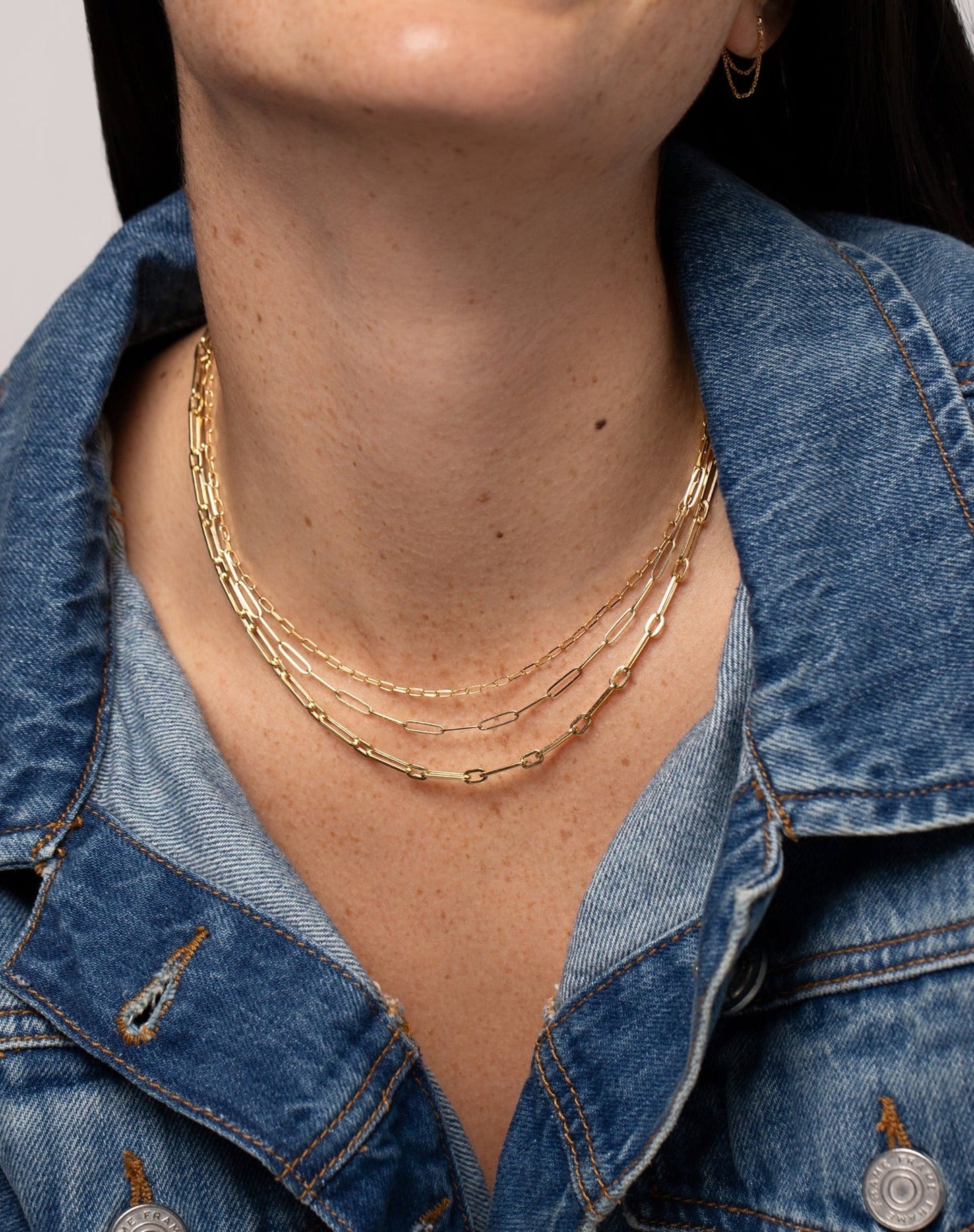 14k yellow gold mini link necklace, small link necklace, and long link chain necklace shown on model