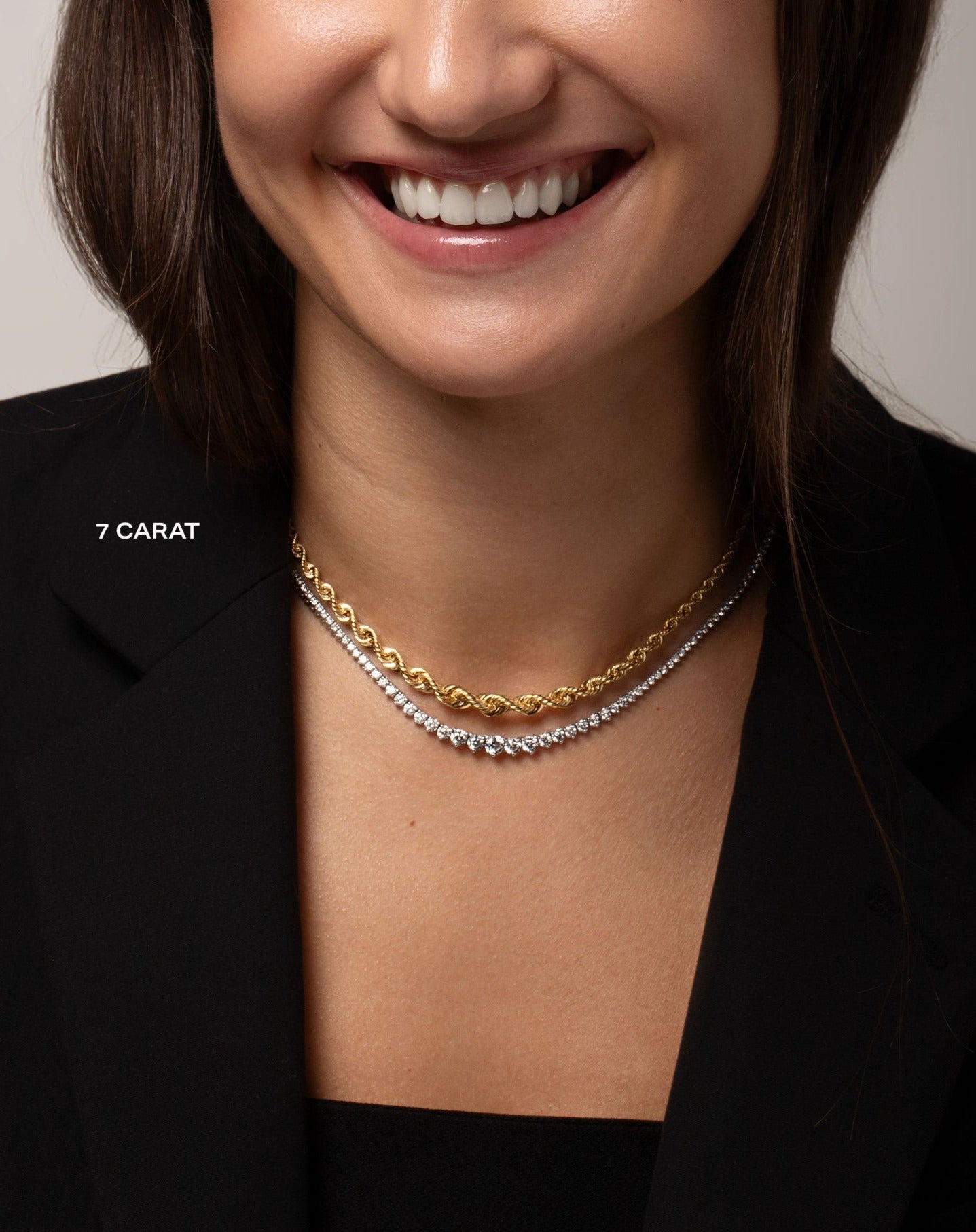 Graduated Diamond Tennis Necklace shown on neck of smiling model