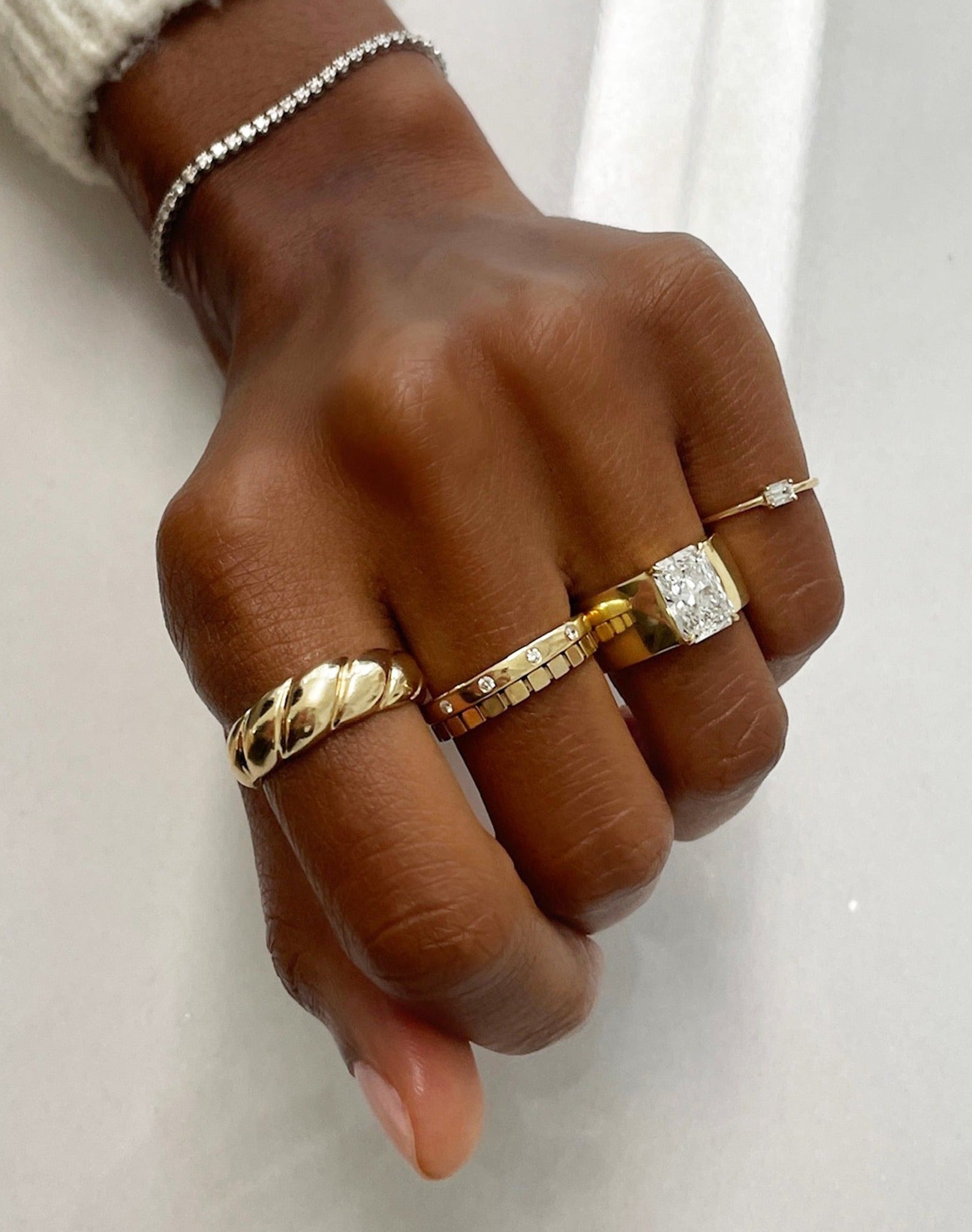 Inlay Diamond Ring styled with 4 other gold rings and tennis bracelet