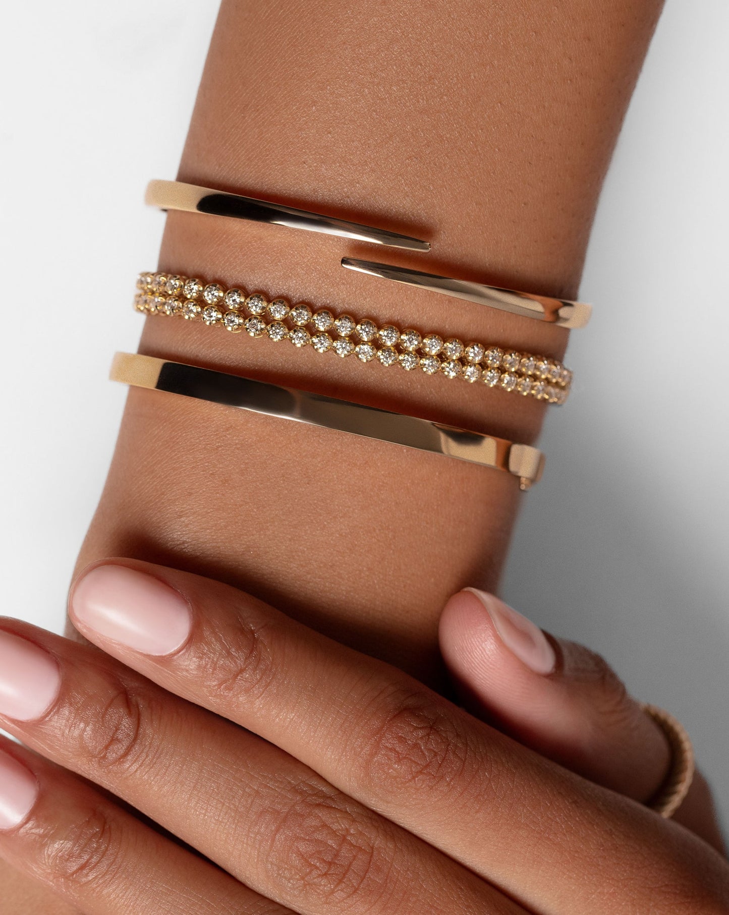 Mutliway double wrapped around wrist worn as bracelet along with two bangles