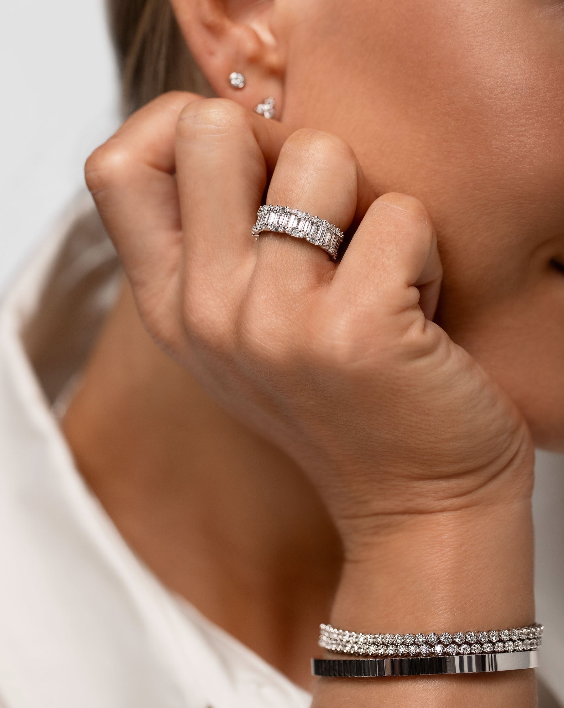 Model wearing Emerald Illusion Ring along with 2 bracelets and 2 studs