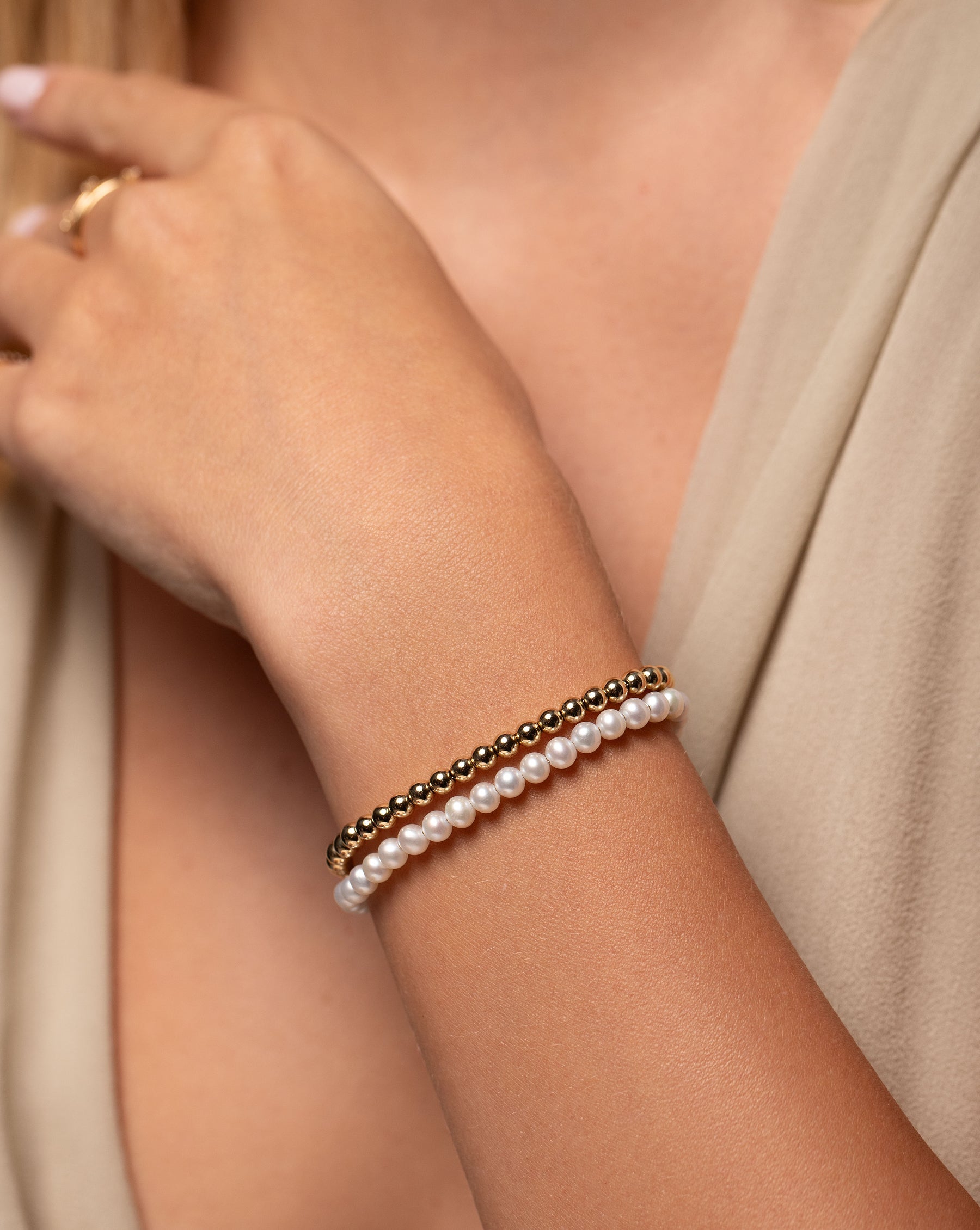 Multiway Pearl and Gold Beaded Necklace + Double Wrap Bracelet shown double wrapped on wrist