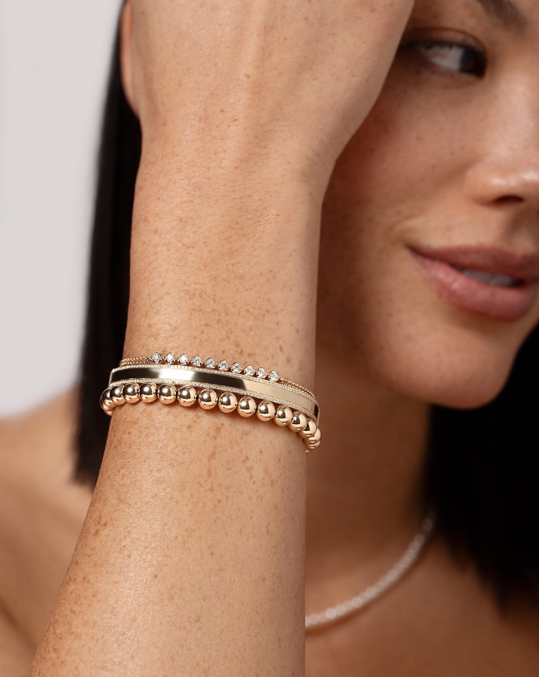 Diamond Border Bangle, Double Chain Diamond Bracelet and Jumbo Gold Bead Bracelet on model