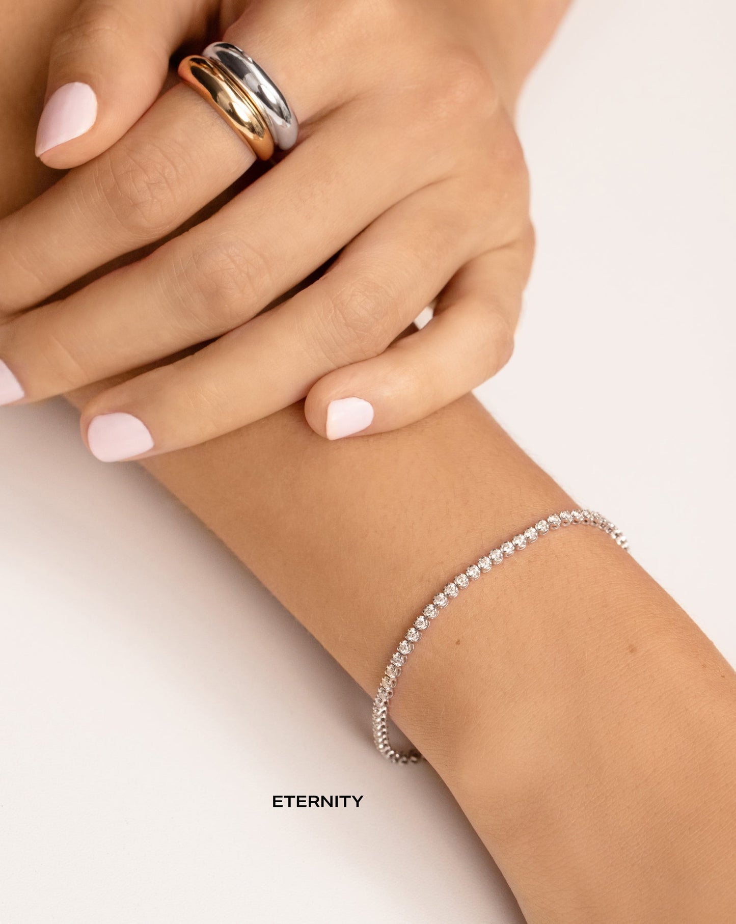 two 14k gold cloud rings, and eternity mini diamond tennis bracelet on model