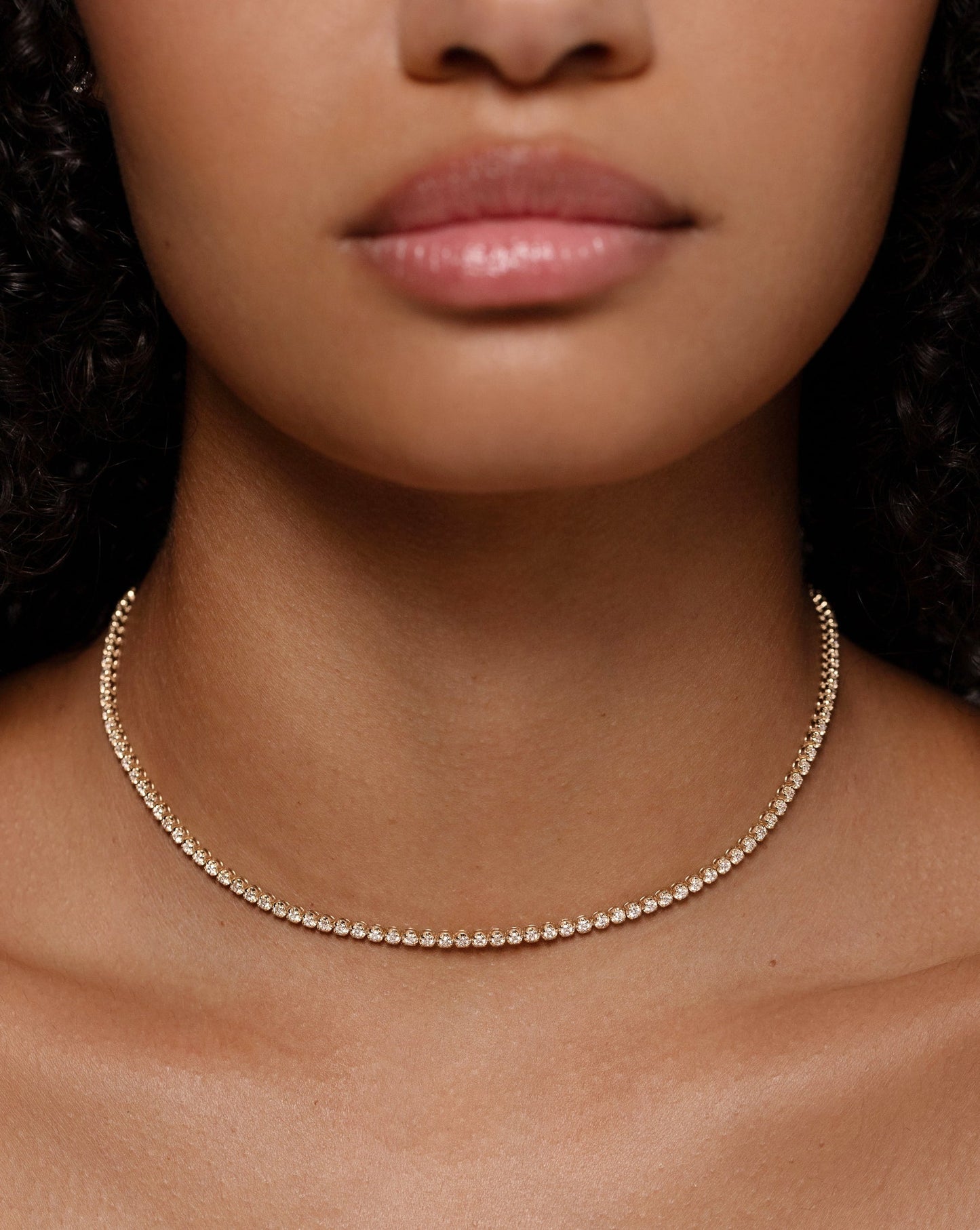 14k yellow gold diamond tennis necklace on model