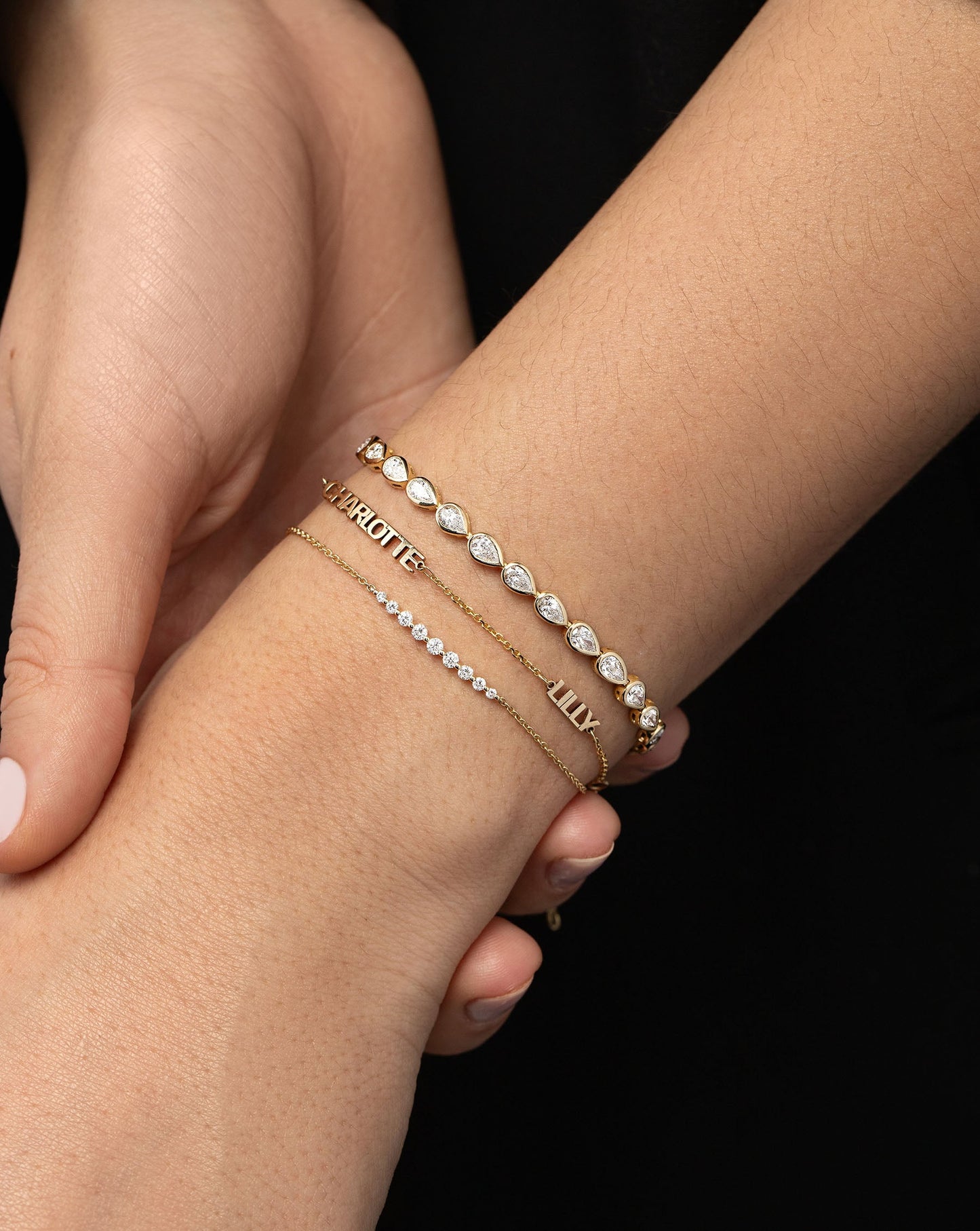 Graduated Single Prong Diamond Bracelet styled with 2 other bracelets