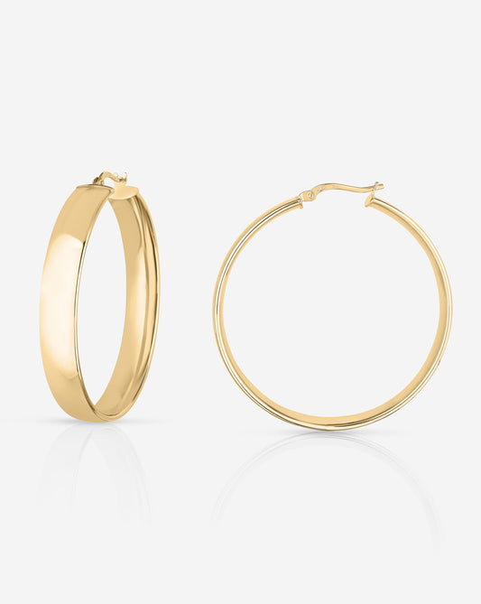 Flat lay of Bold Gold Flat Hoops in size Large