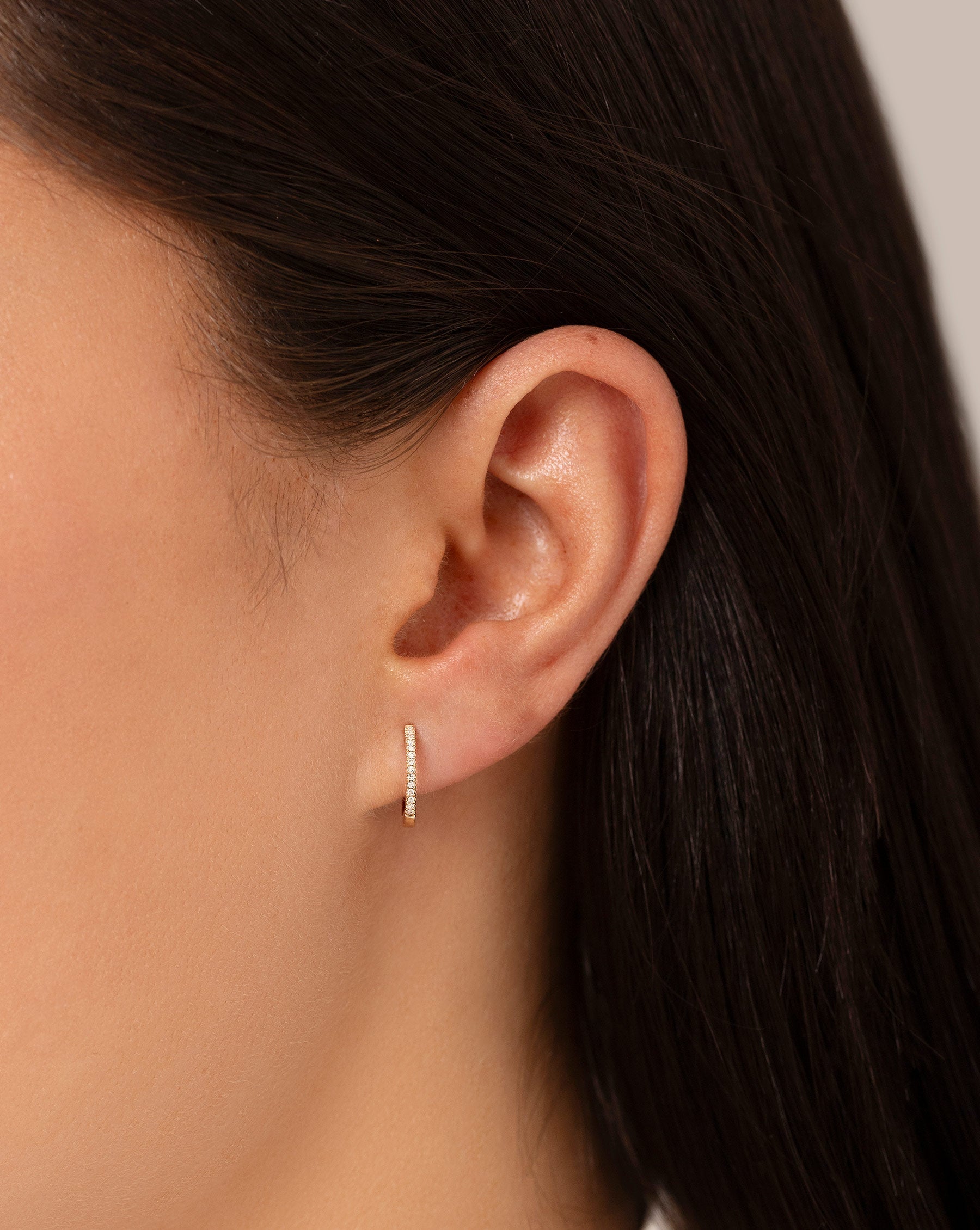 Diamond Huggies shown alone on ear of model