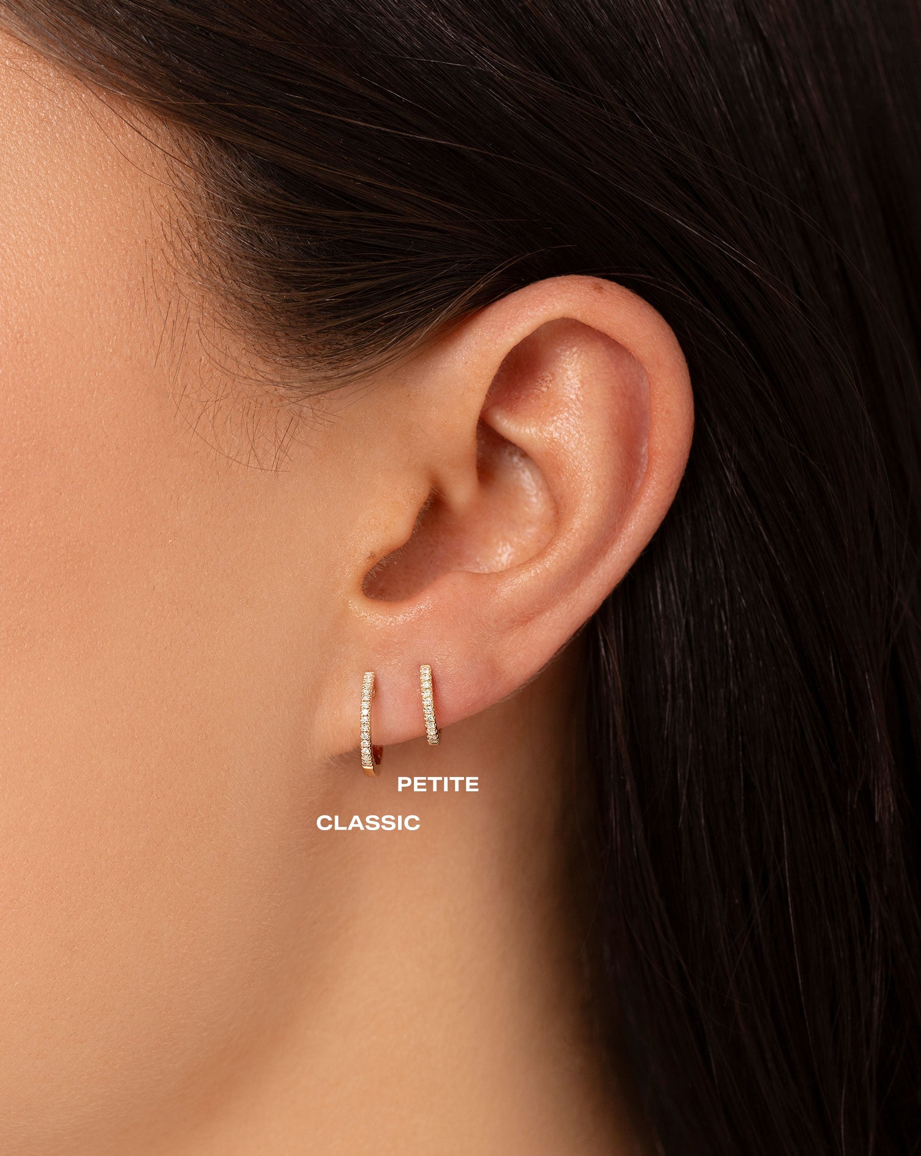 Comparison image of the Diamond Huggies and Petite Diamond Huggies on ear of model
