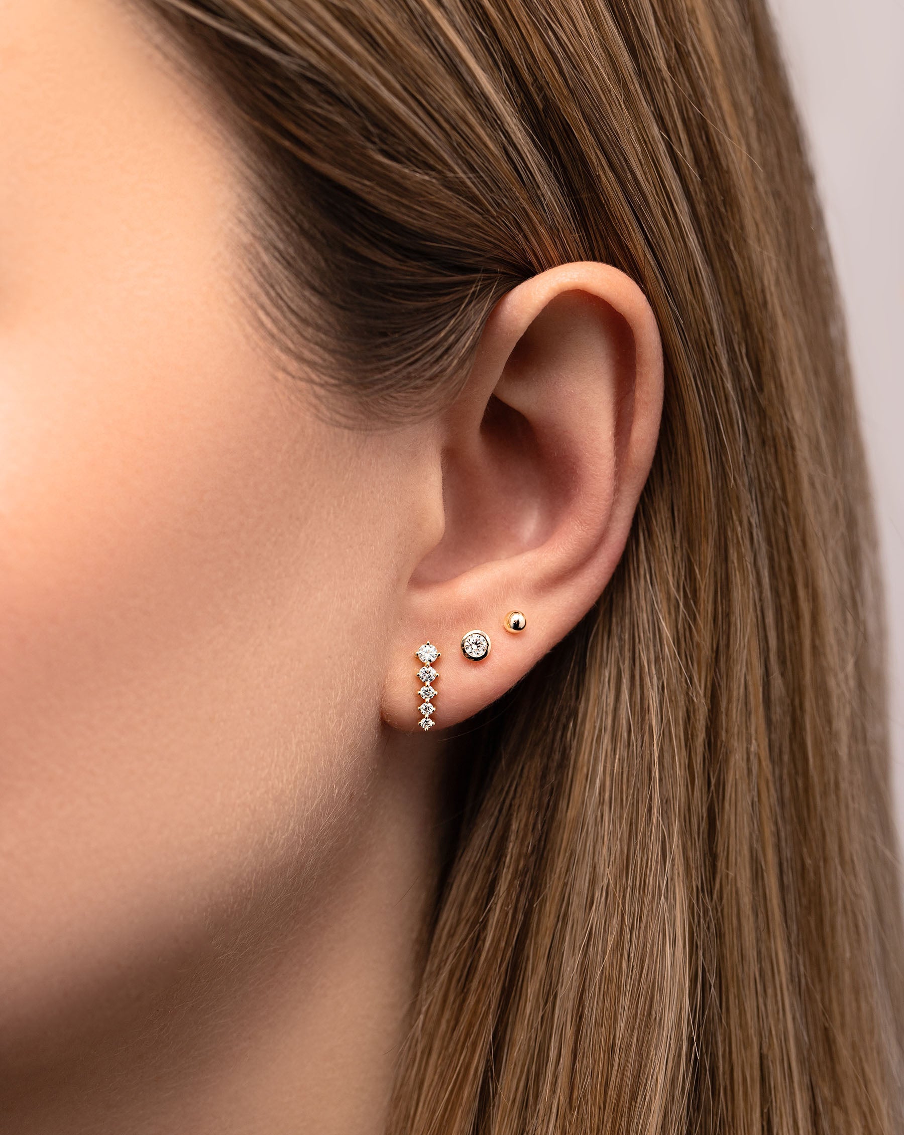 Graduated Curved Studs styled with 2 studs on model