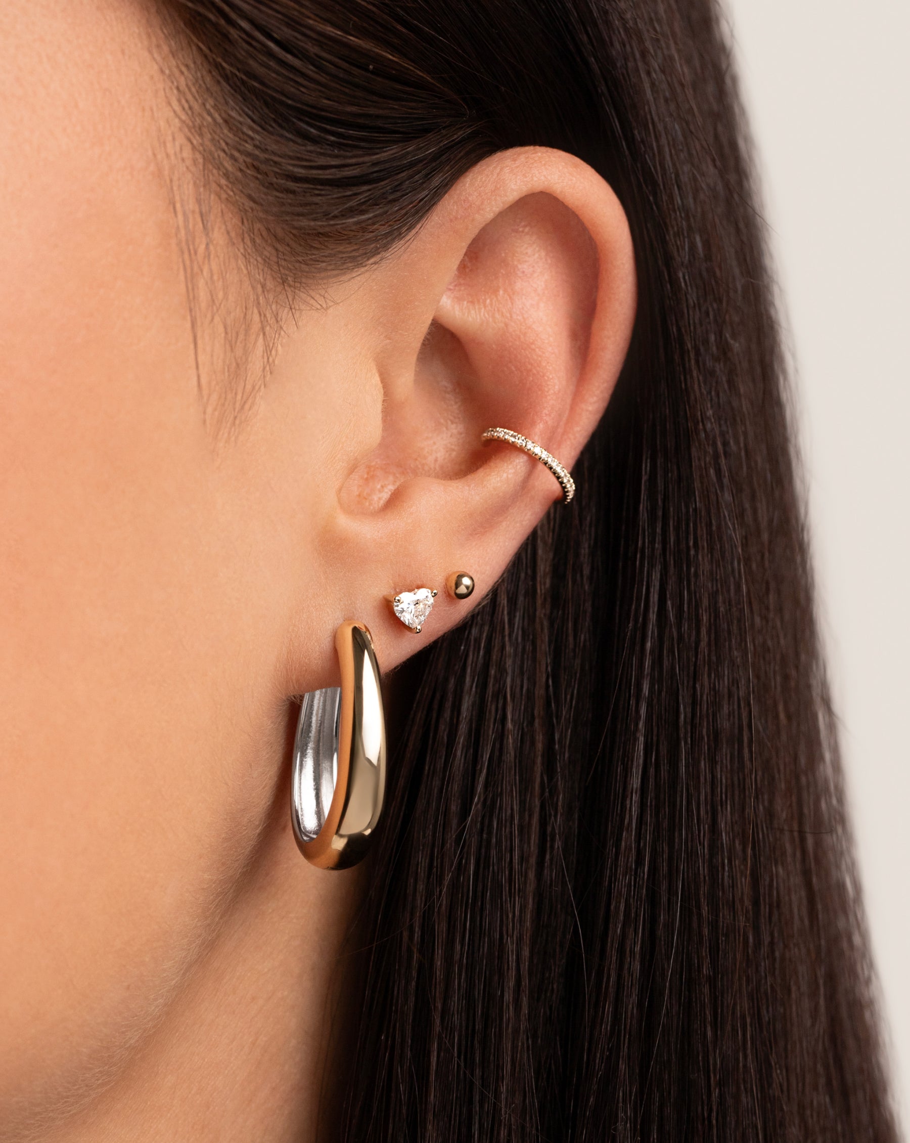 Diamond Ear Cuff styled with multiway hoops and two studs on model