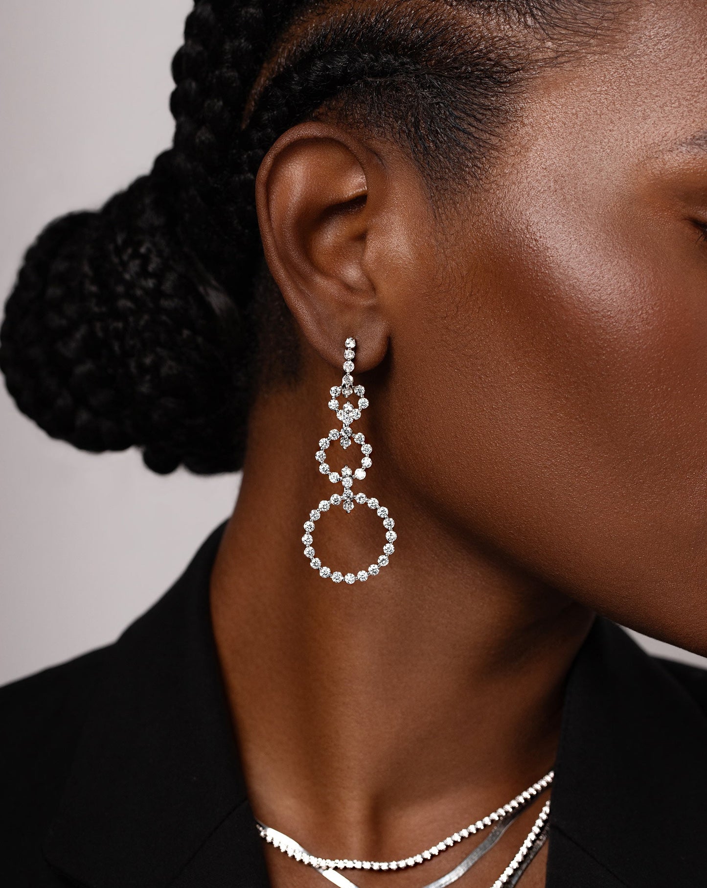 diamond statement earrings featuring three graduated circle drop hoops shown on model