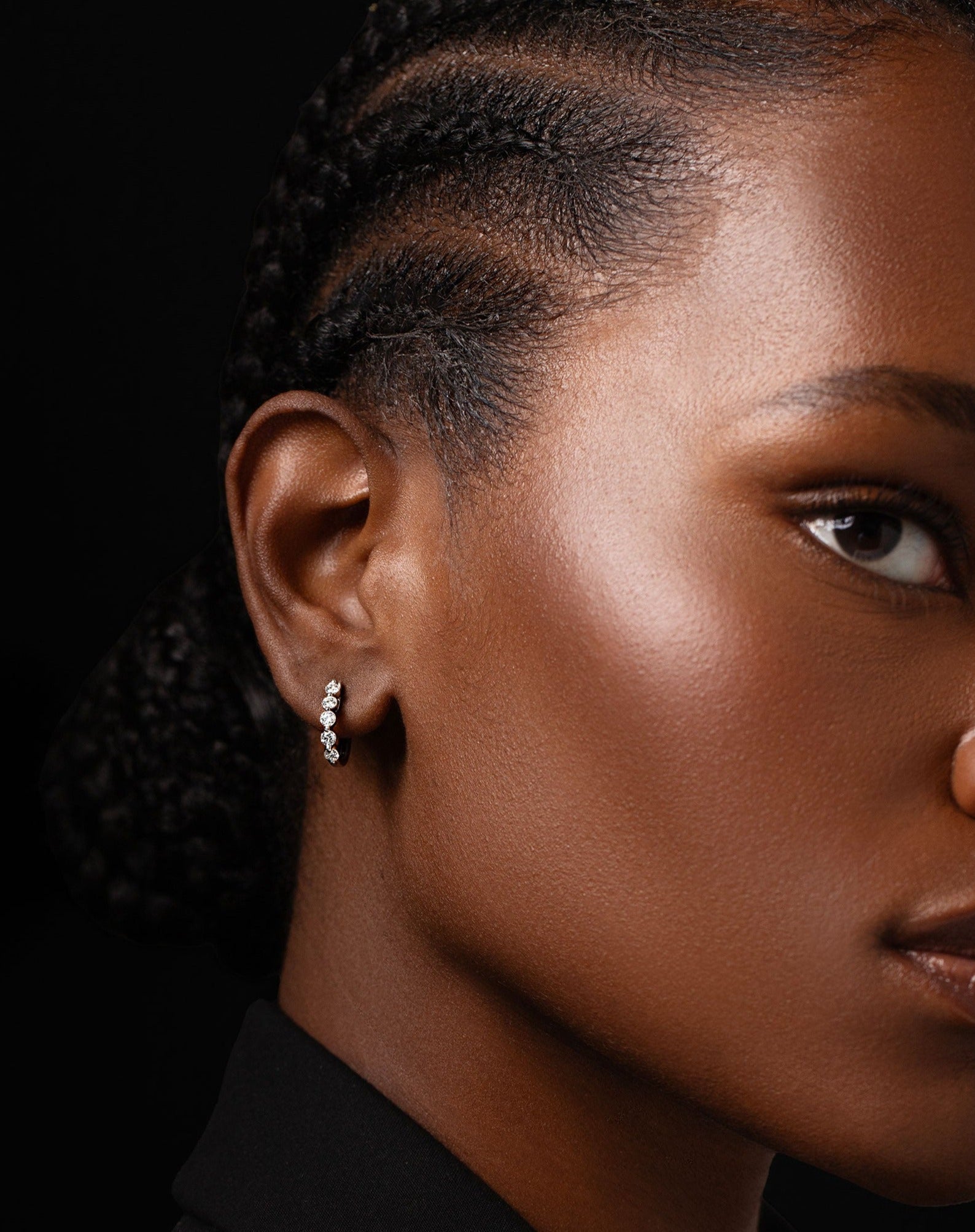 Graduated diamond huggie shown on model