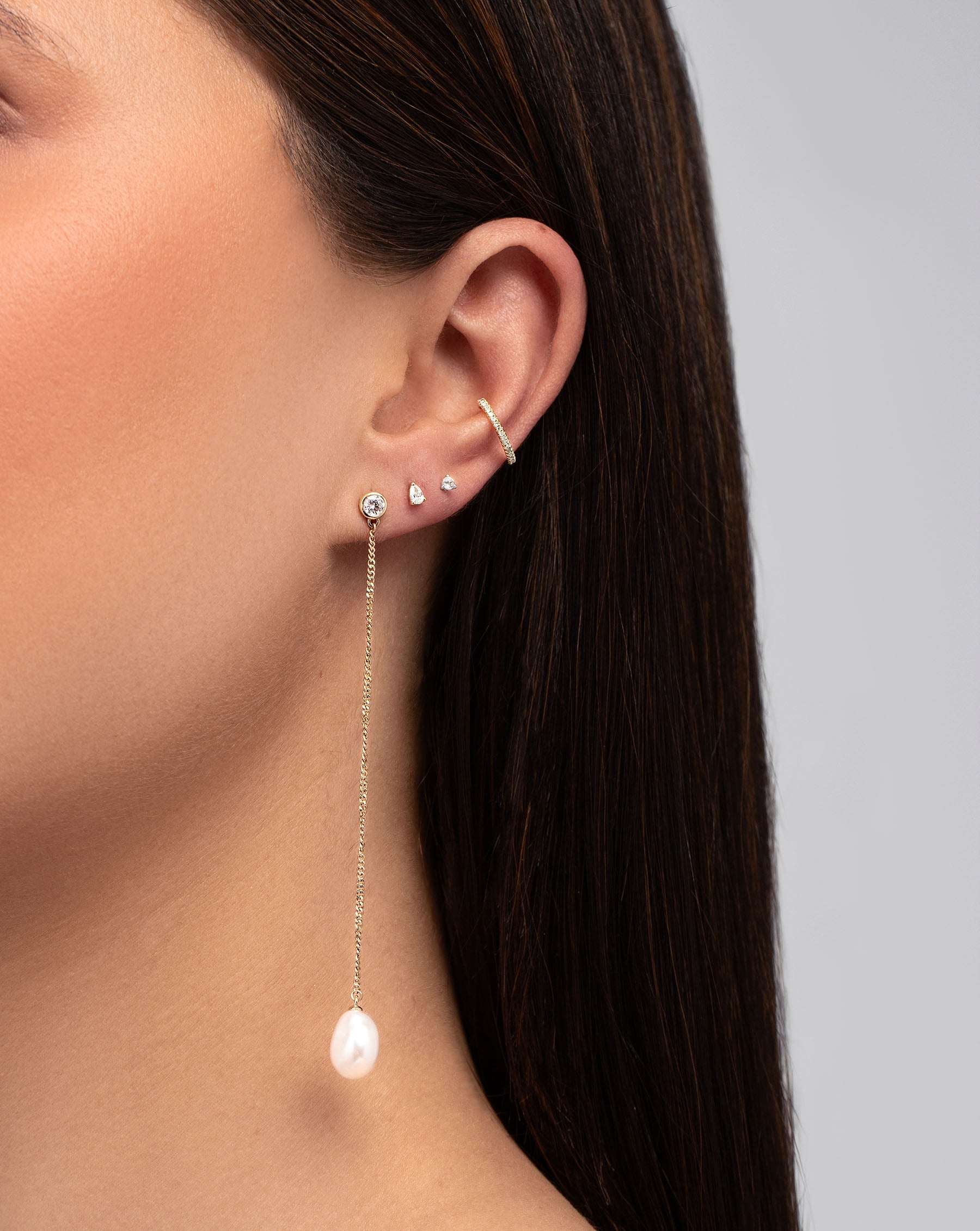 Organic Pearl + Diamond Drop Earrings on model styled with 3 other earrings