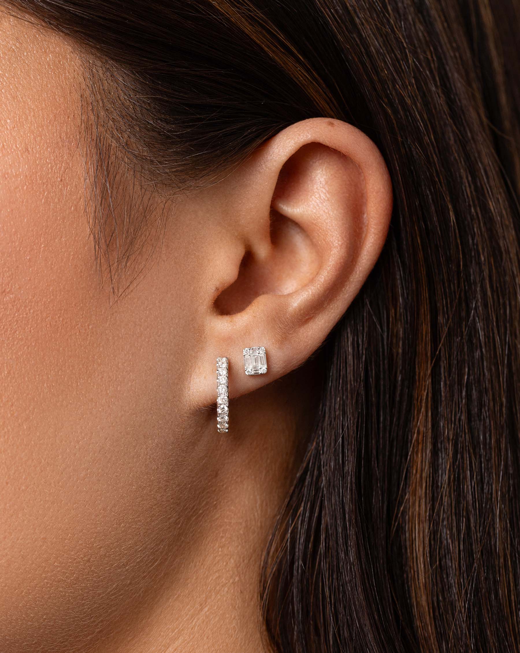 Petite Emerald Illusion Studs styled with jumbo diamond huggies on model