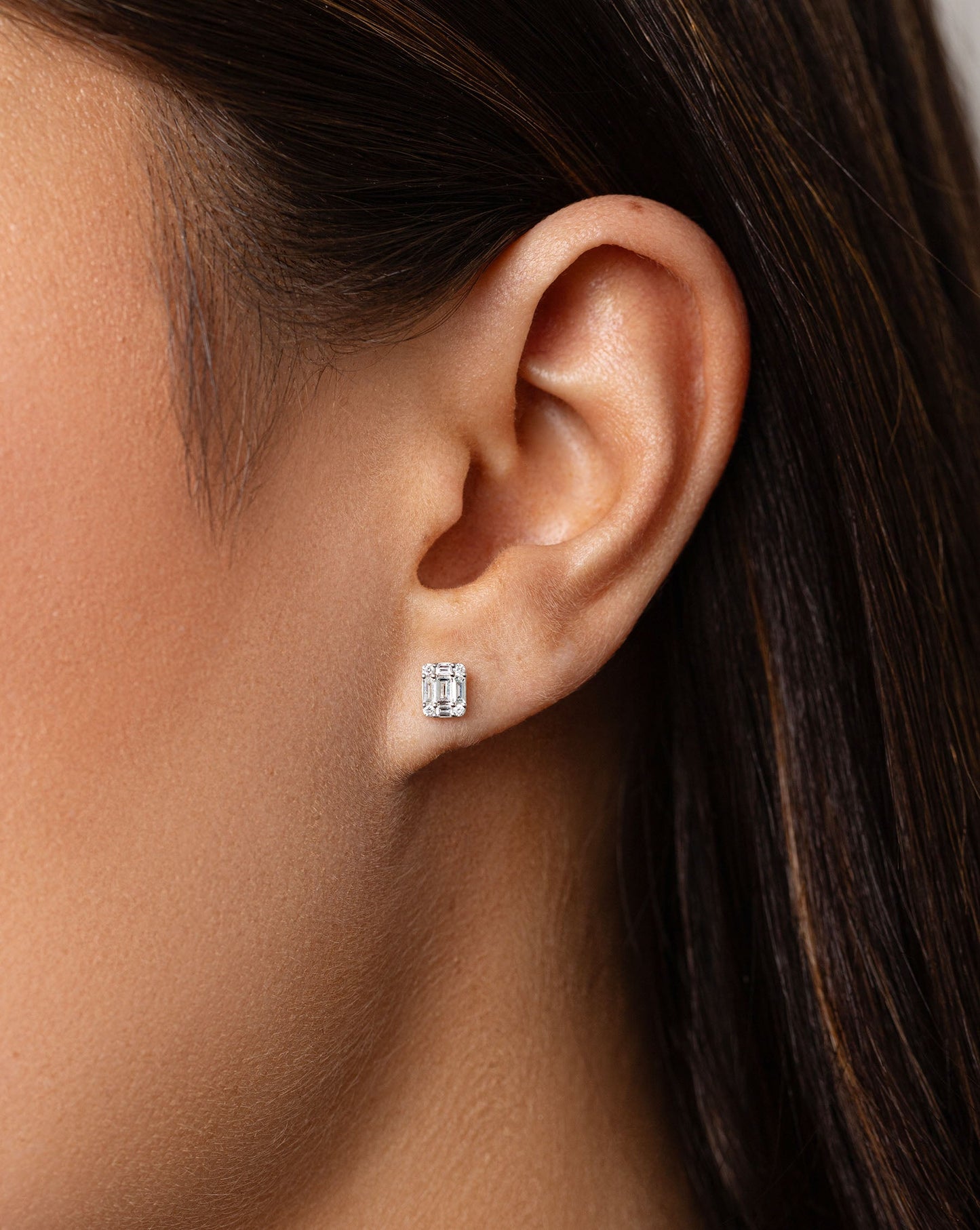 Petite Emerald Illusion Studs on model