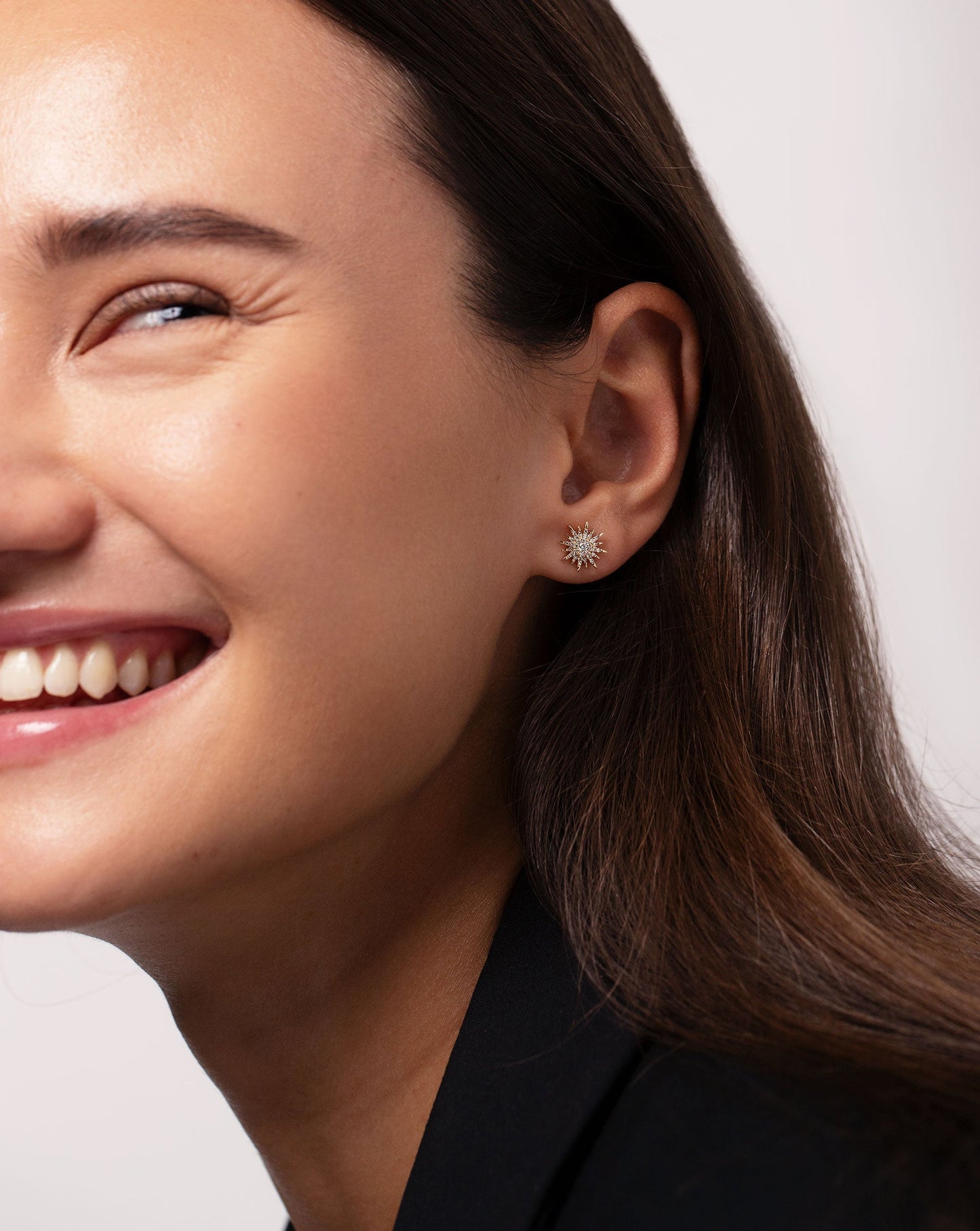 Ring Concierge 14K yellow Gold Starburst Diamond Studs - on-model with black top and styled with gold huggie in cartilidge