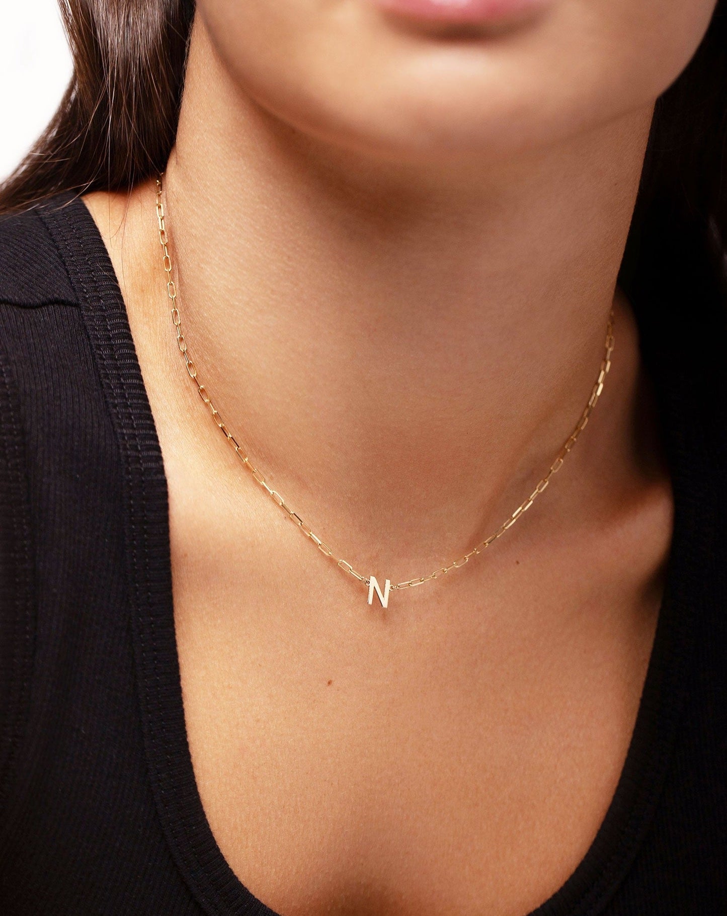 Ring Concierge Block initial + link chain necklace with letter N on model wearing a black tank top