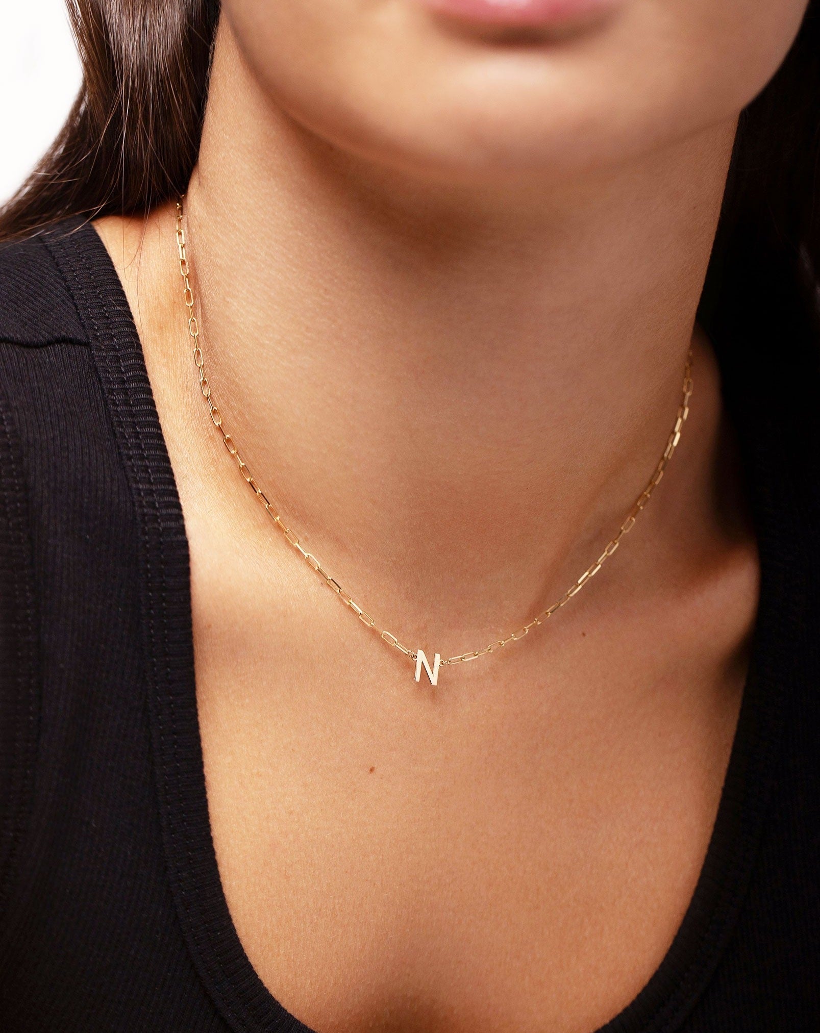 Ring Concierge Block initial + link chain necklace with letter N on model wearing a black tank top