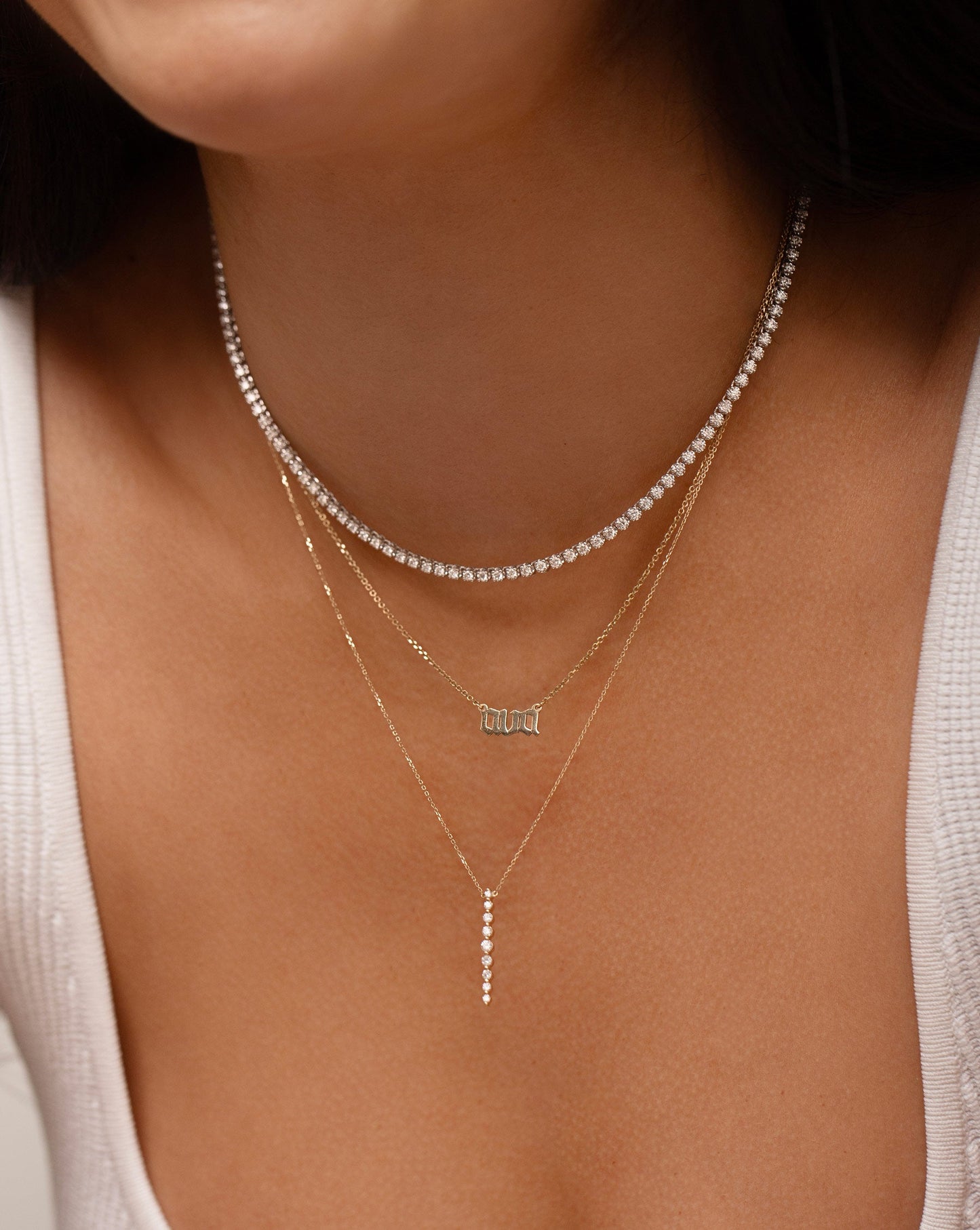 Cupcake Set Diamond Tennis Necklace worn with the Personalized Gothic Letter Necklace and Vertical Graduated Single Prong Diamond Necklace