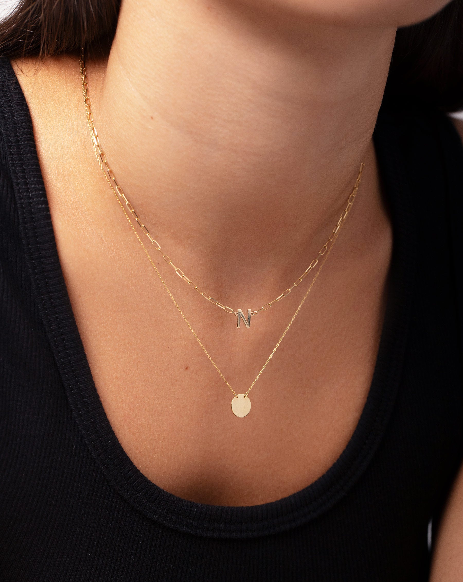 Block Initial + Link Chain Necklace with the letter N worn on model's neck with the Engravable Mini Coin Necklace
