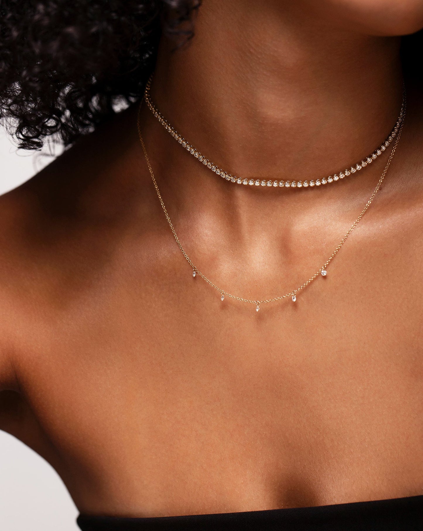 Floating Diamond Necklace shown on neck with Multiway Diamond Tennis Necklace + Double Wrap Bracelet