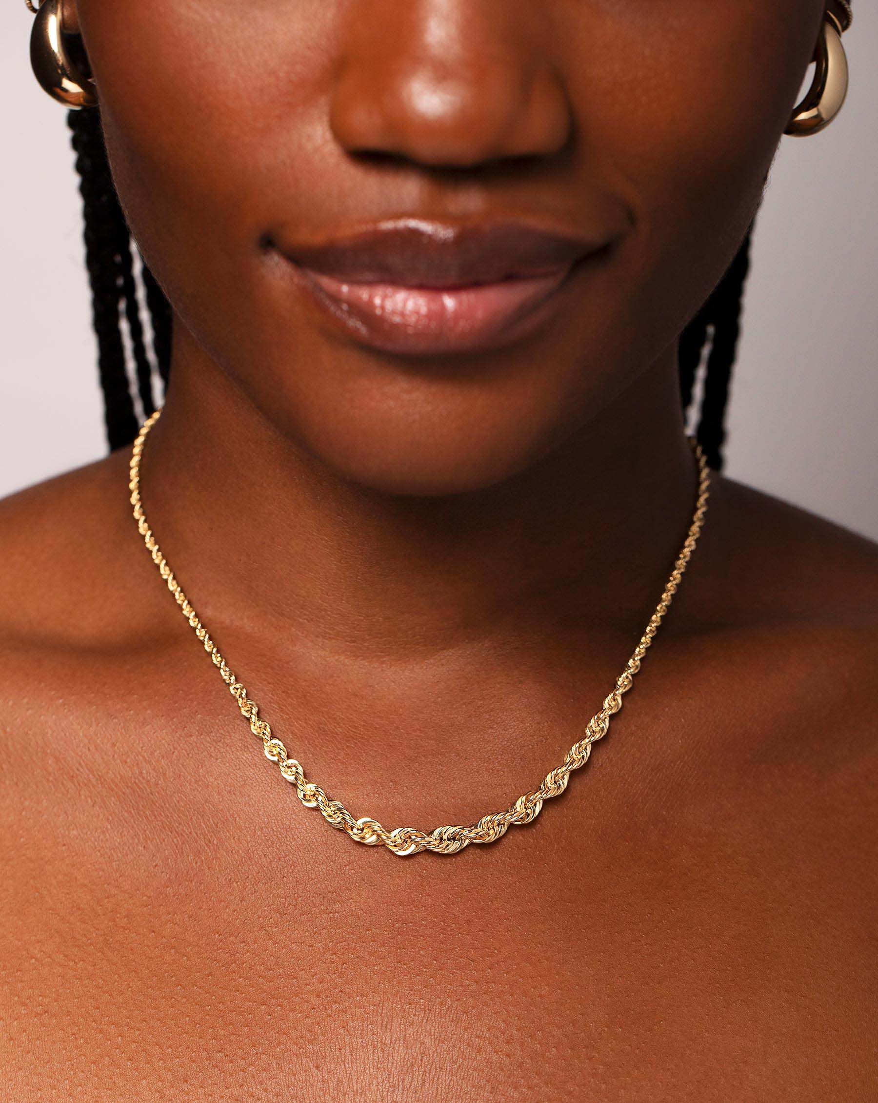 RC Graduated Rope Chain Necklace in 14K Yellow Gold styled on model's neck