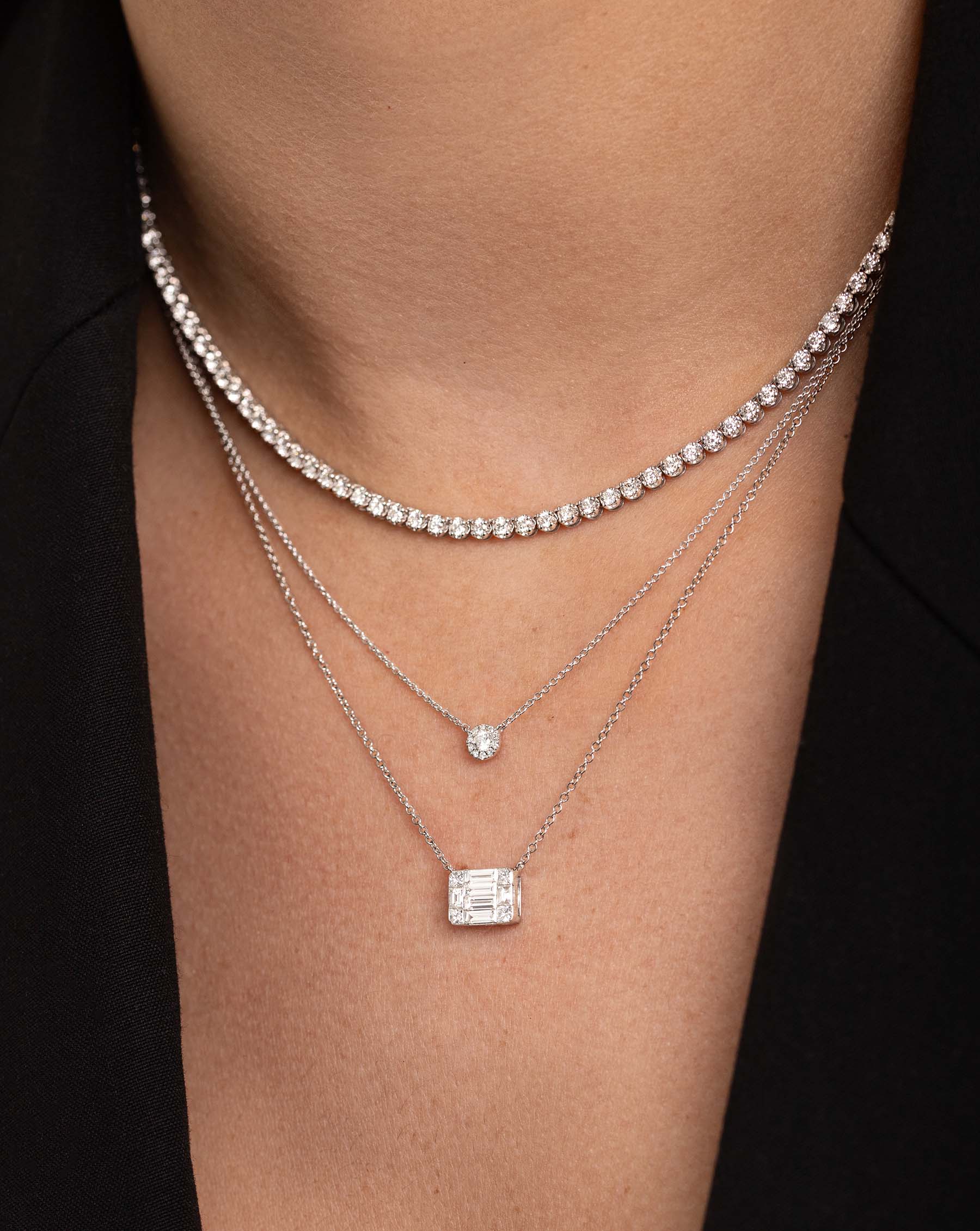 Large Emerald Illusion Necklace styled with Diamond Cluster pendant necklace and luxe diamond tennis necklace