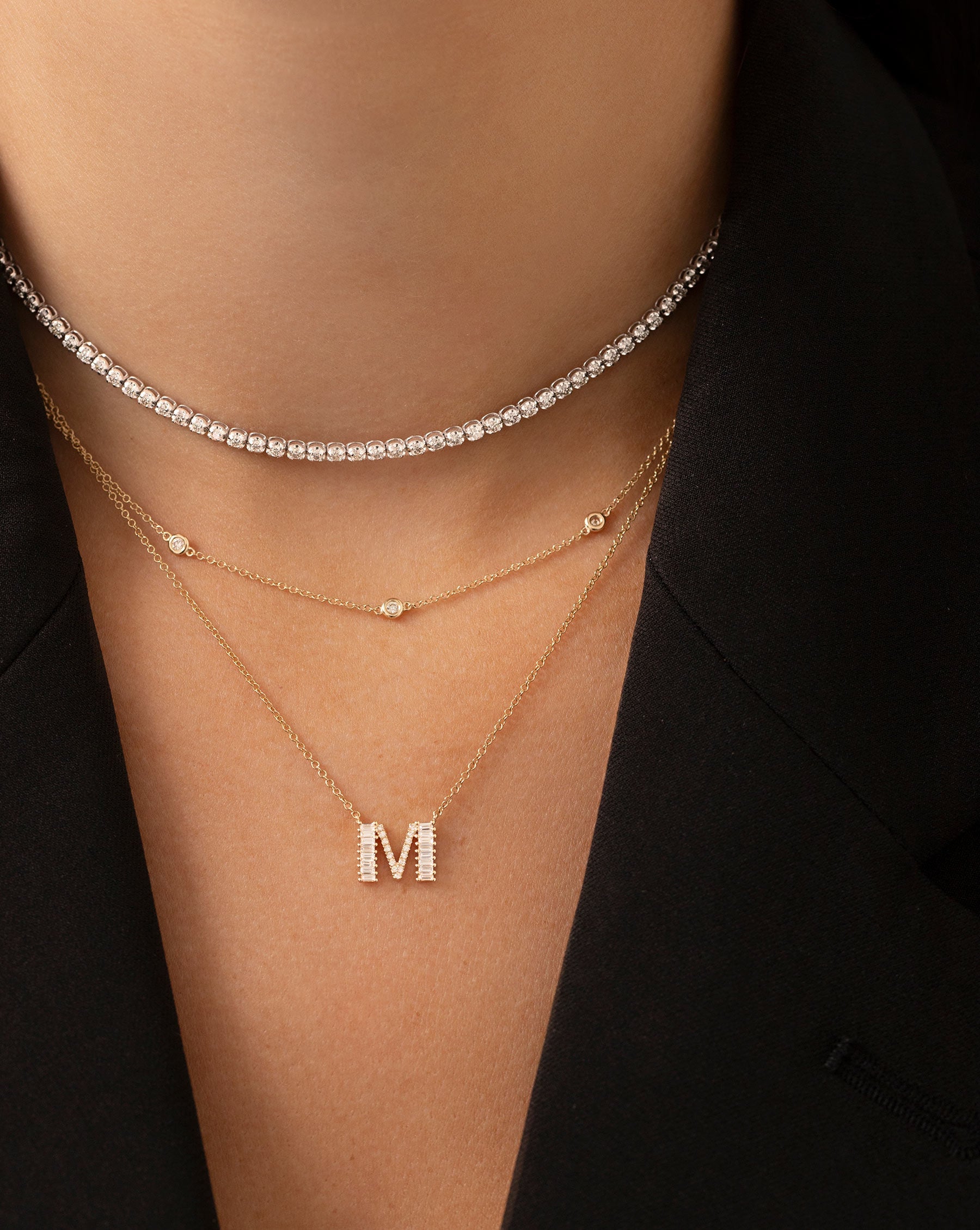 Multiway Tennis Necklace + Double Wrap Bracelet shown styled with the Baguette + Pave Initial Necklace and the Diamond Bezel Station Necklace 