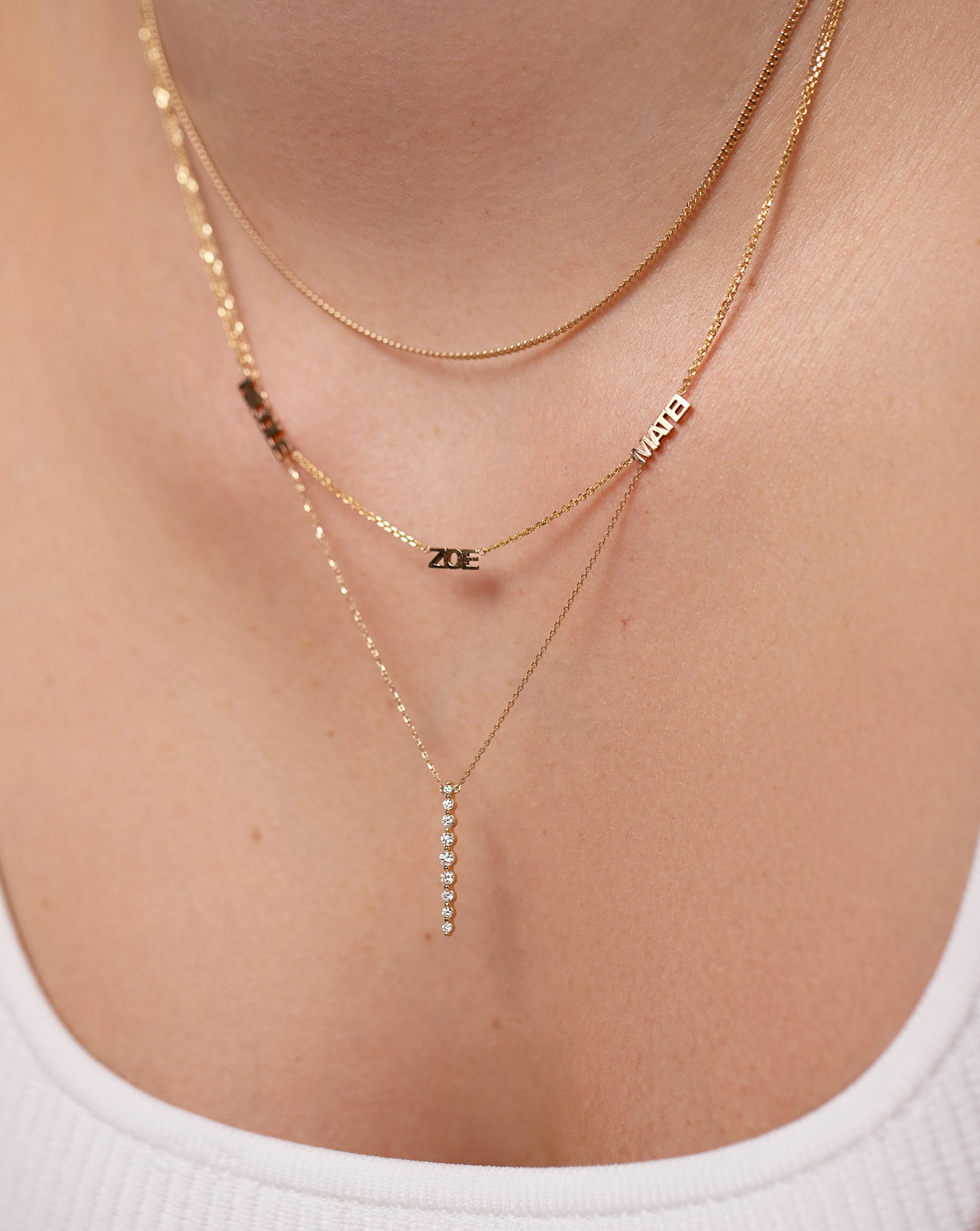 Vertical Graduated Single Prong Diamond Necklace, Personalized multi-name necklace and diamond cut curb chain necklace on model