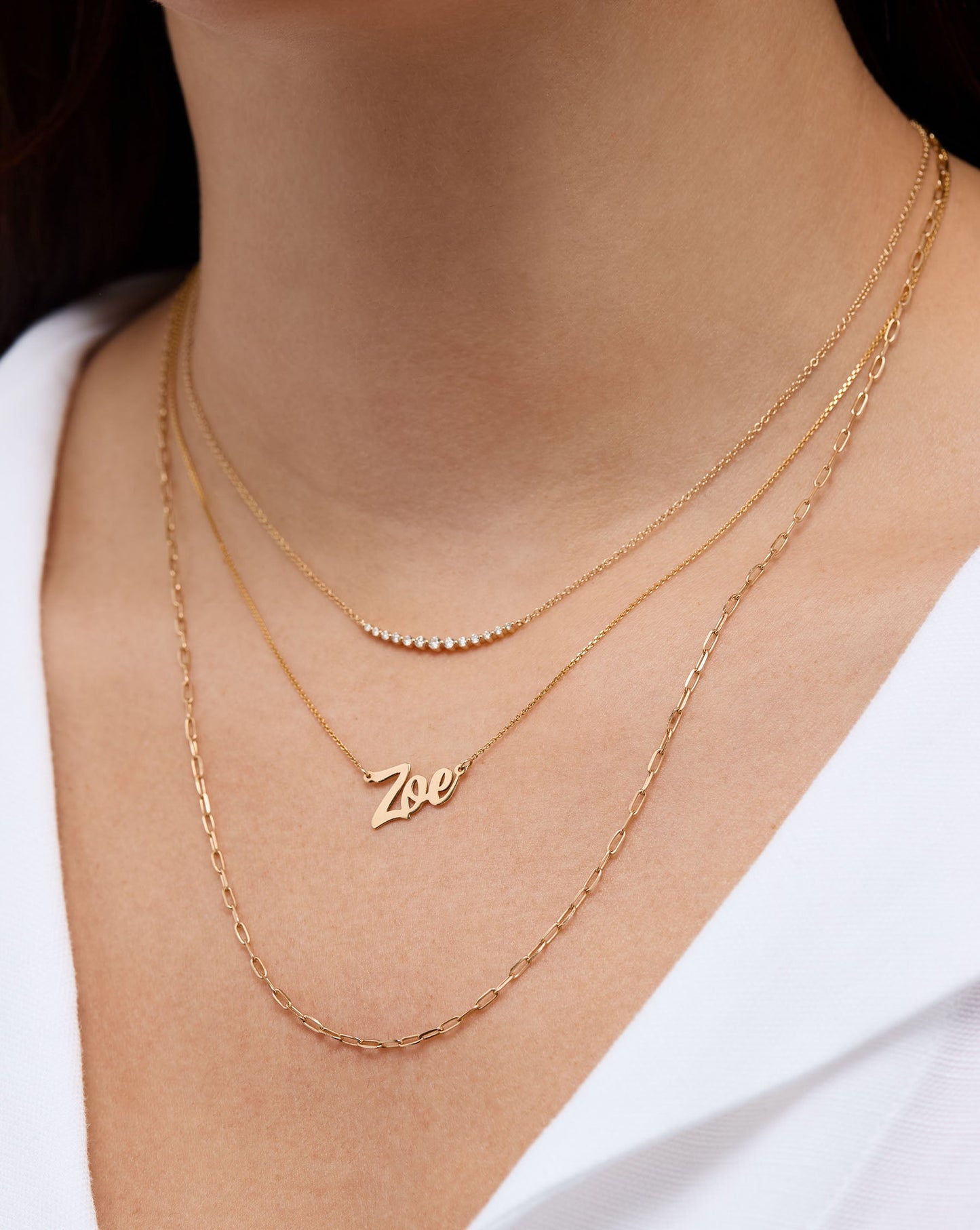 Personalized Script Name Necklace Zoe styled with 2 other yellow gold necklaces