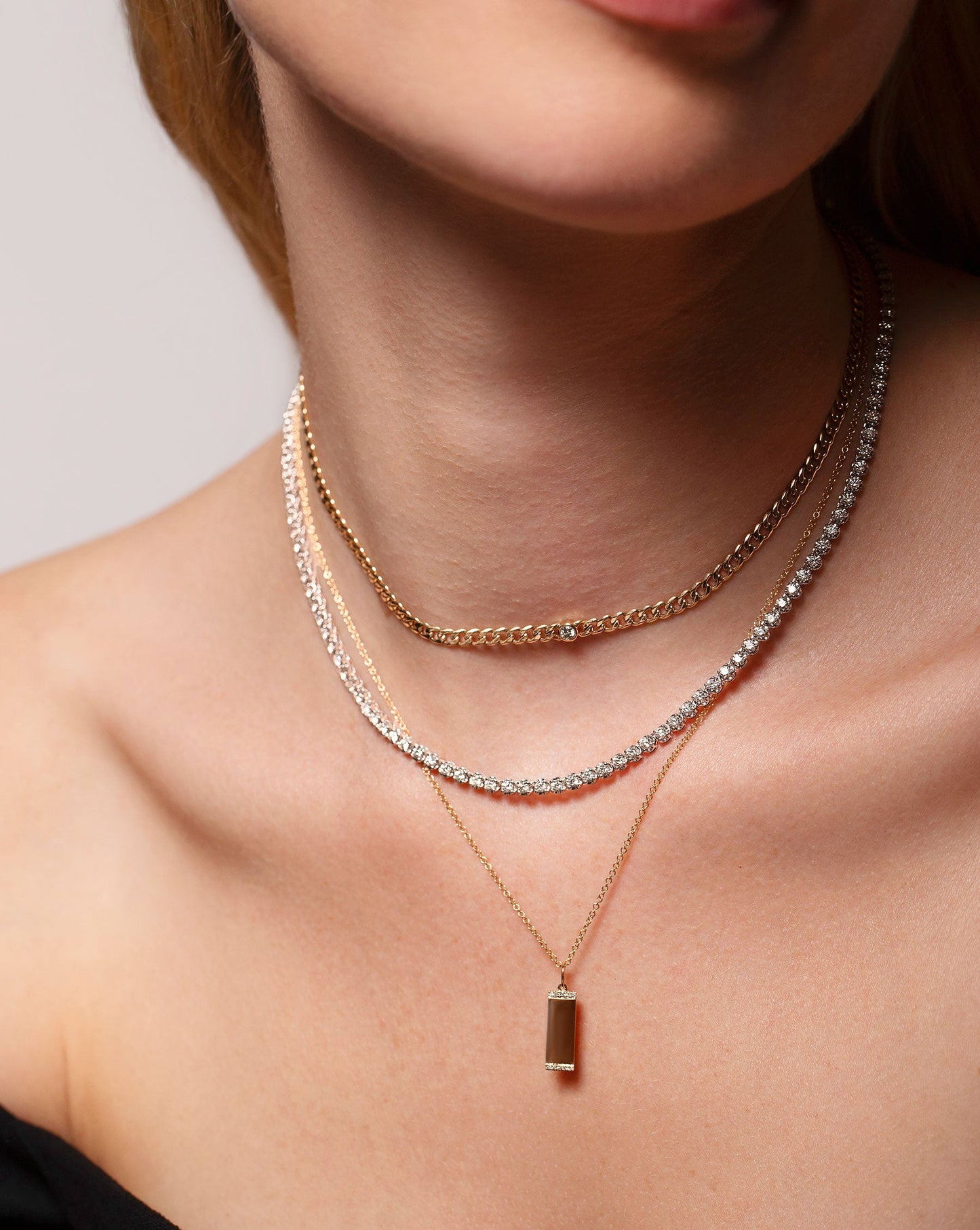 Petite Bezel-Set Diamond Curb Chain Necklace shown around neck with the Cupcake Tennis Necklace and Engravable Diamond Tag Necklace.