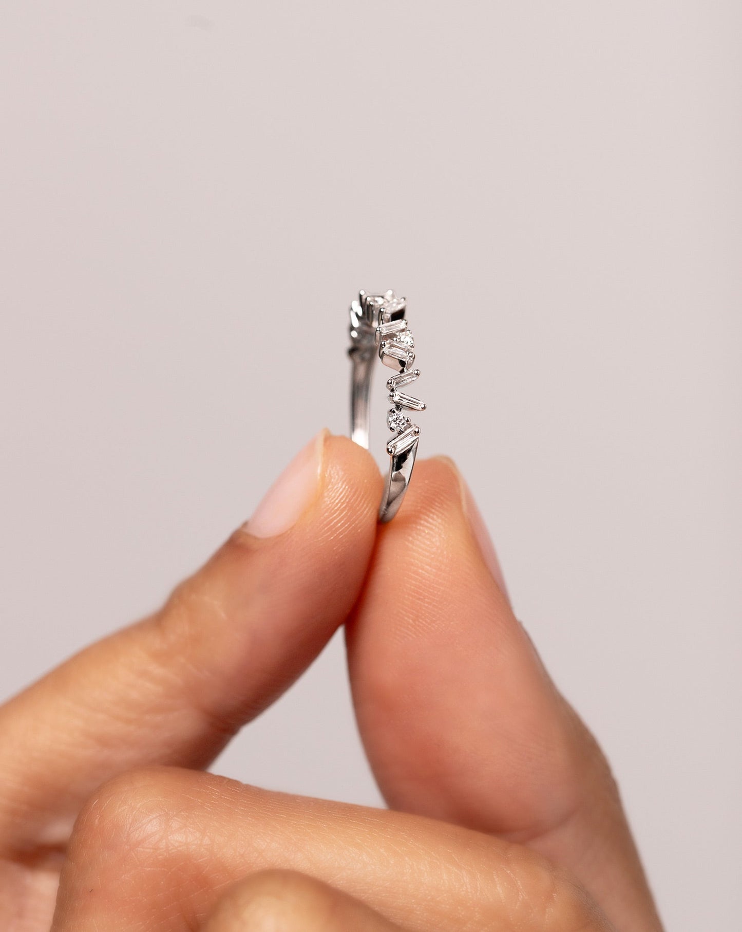 Model holding Mixed Shape Diamond Ring