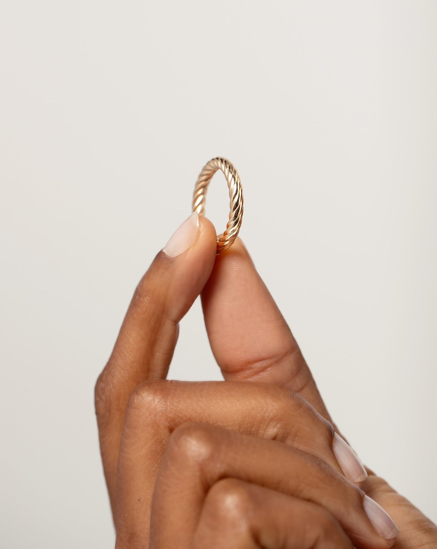 model holding Twisted Cable Ring