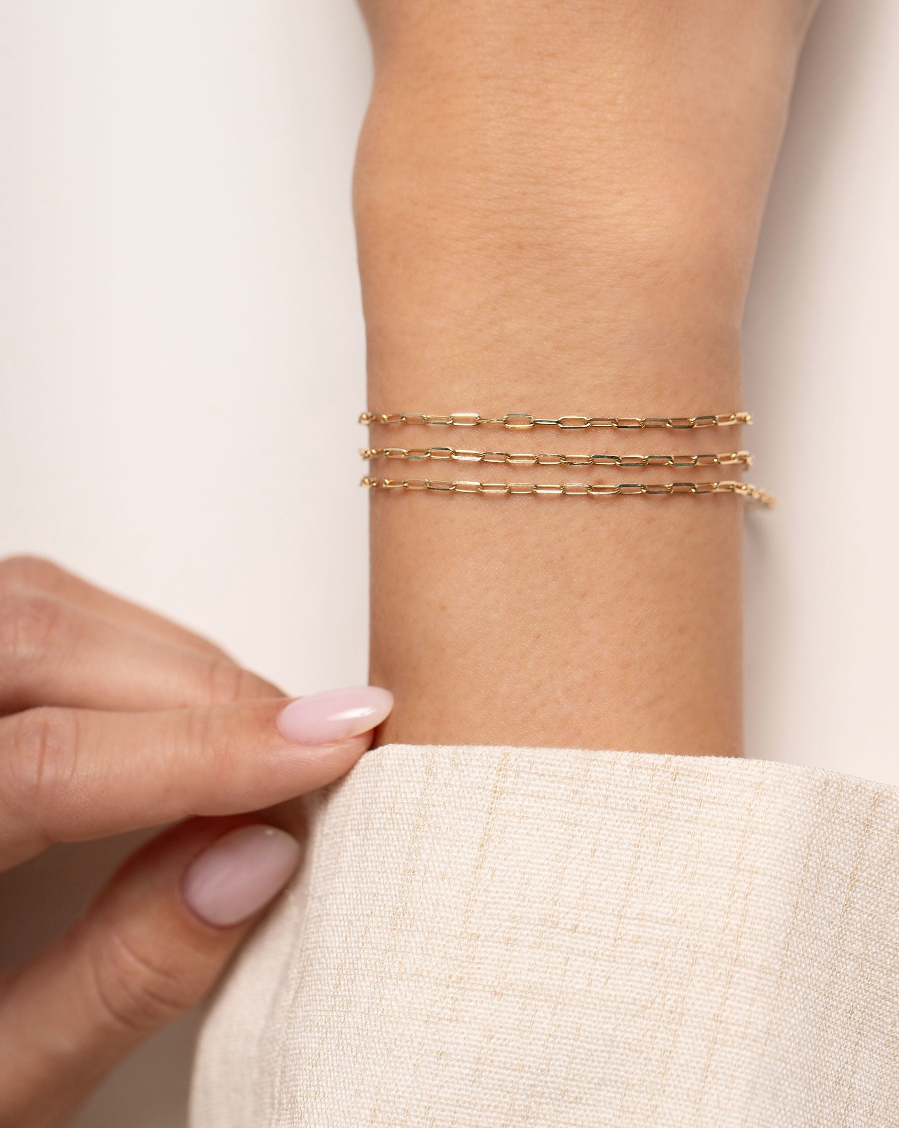 Multiway Mini Link Necklace + Triple Wrap Bracelet on model as a bracelet