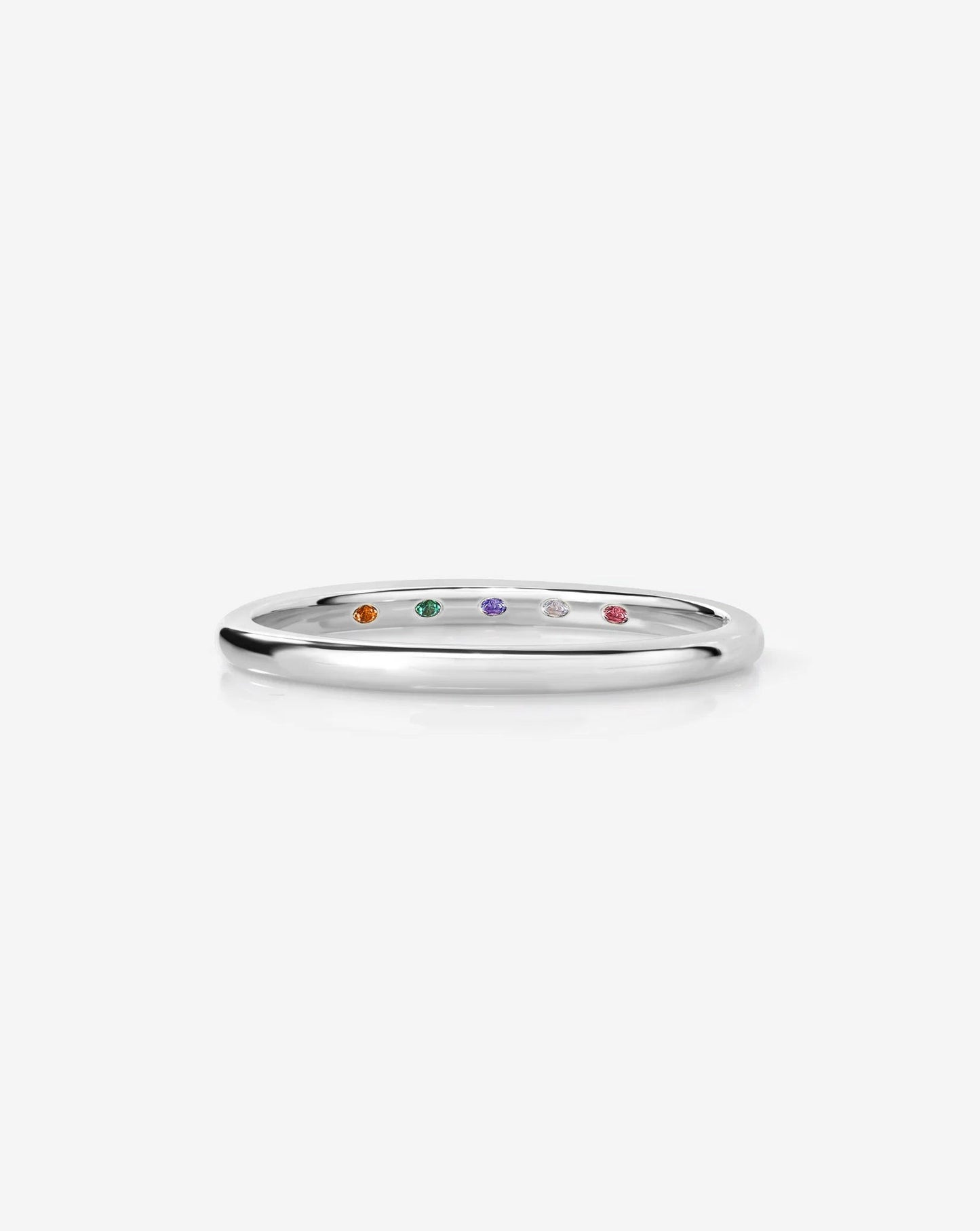 whisper thin band with birthstone on white background in 14k white gold