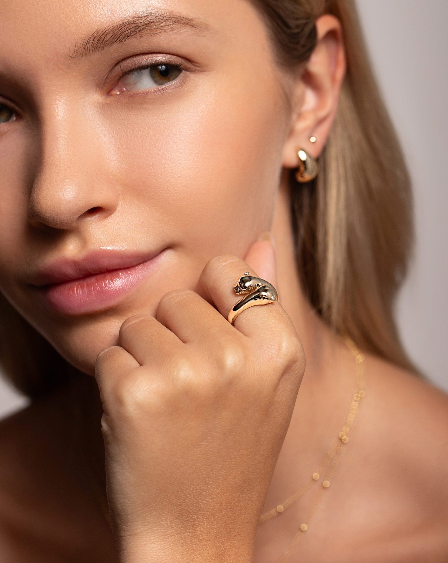 14k yellow gold gold double panther head wrap ring on model