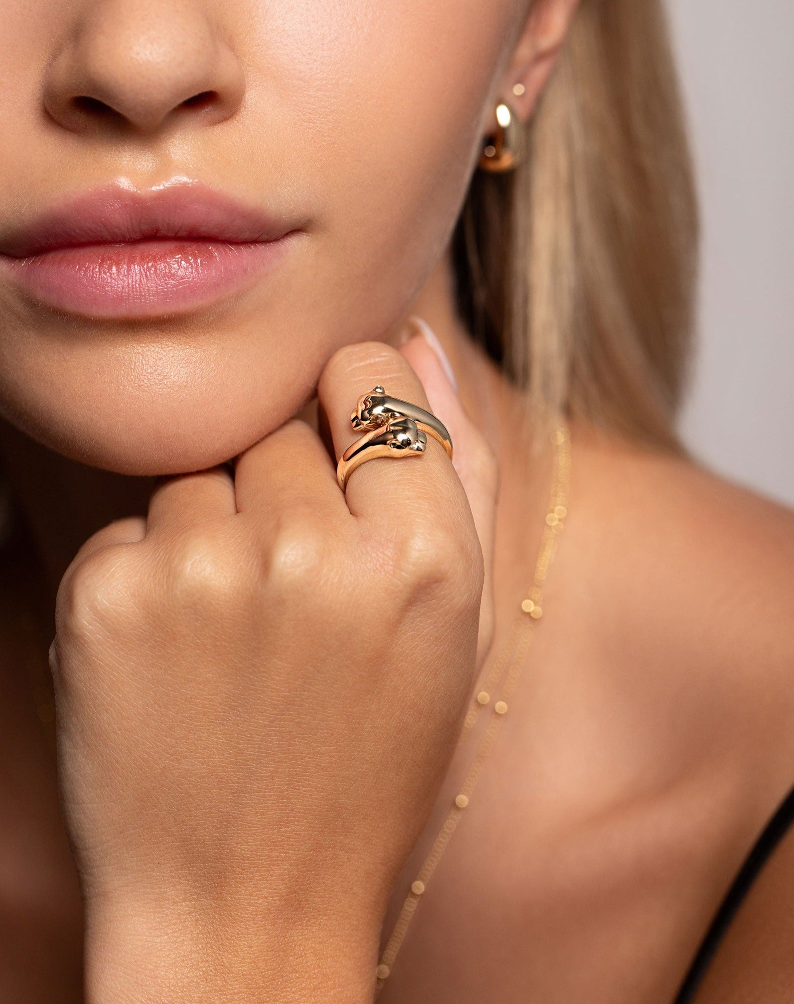 14k yellow gold gold double panther head wrap ring on model