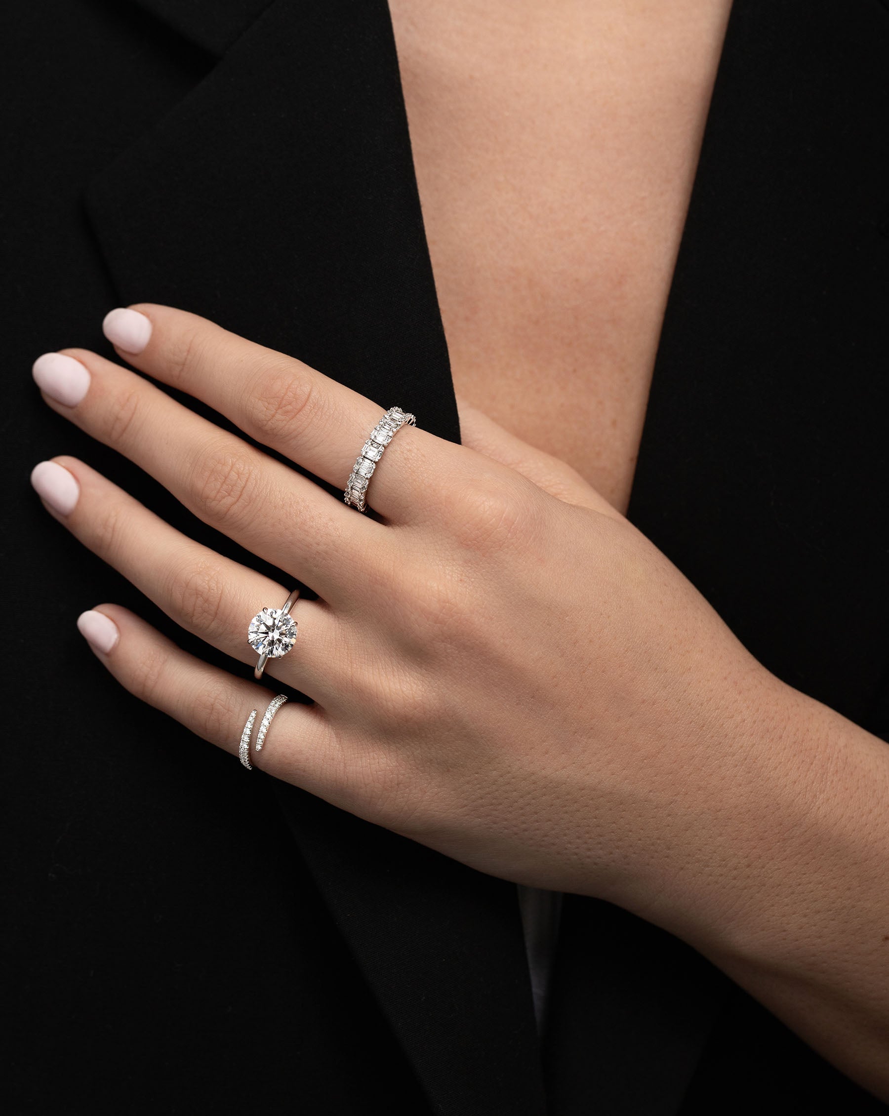 Petite Emerald Illusion Ring on pointer finger on model