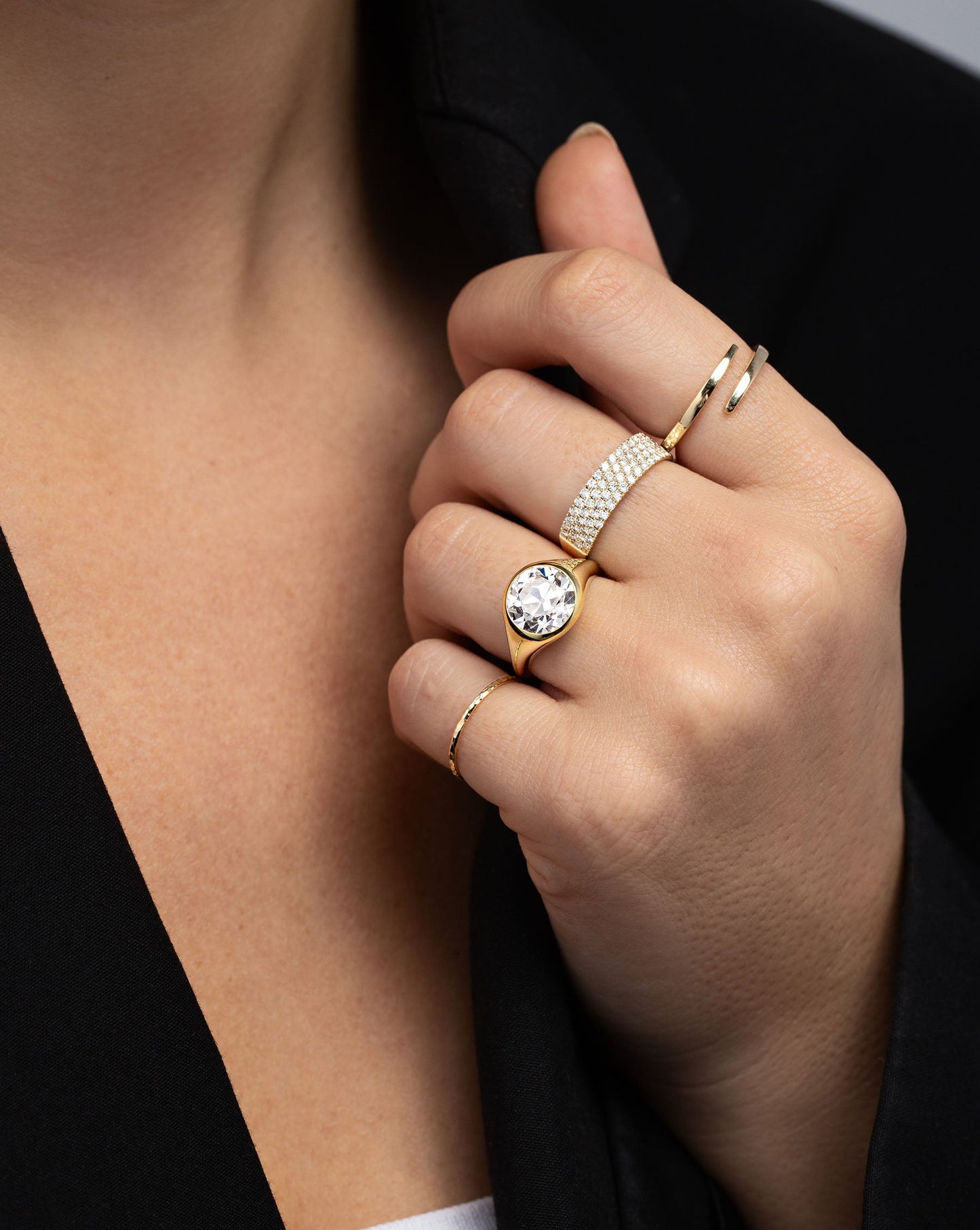 Four Row Stackable Pavé Ring styled with 3 other rings on model