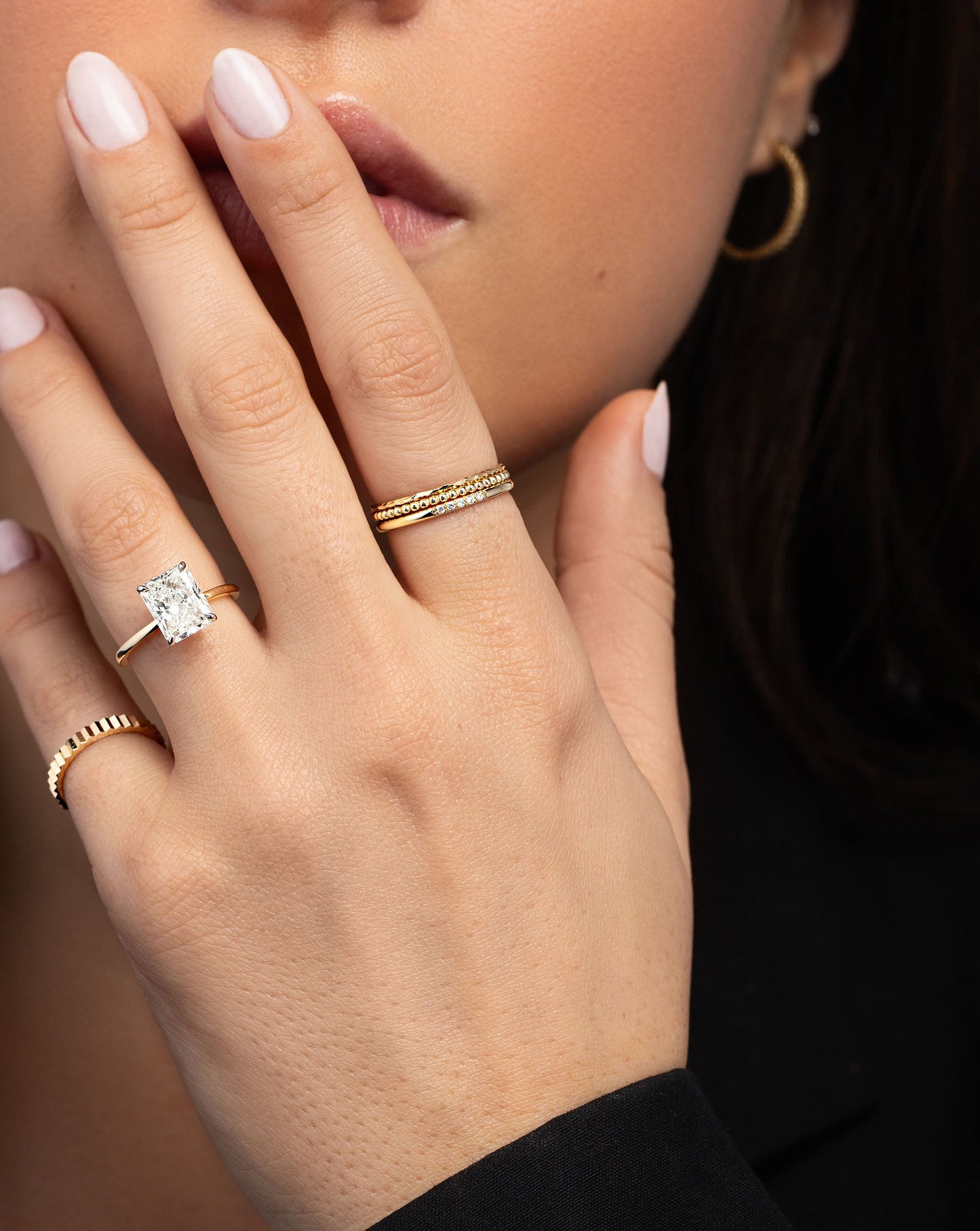 Beaded Stackable Ring stacked with 2 other gold rings on pointer finger