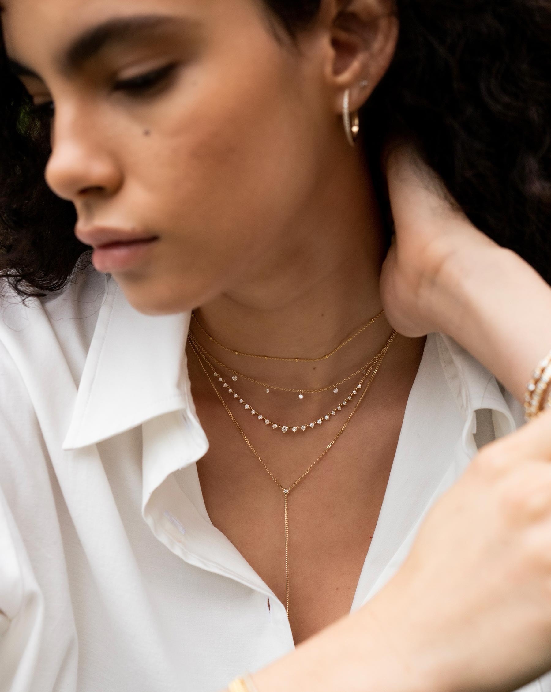 Ring Concierge 14K Graduated Diamond Layering Necklace styled with three additional delicate RC necklaces 