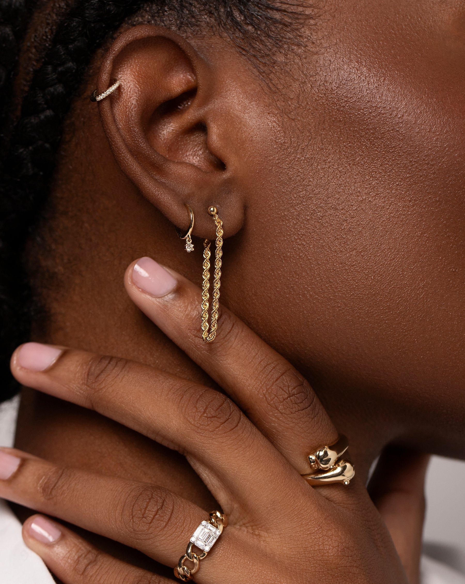 Mini Diamond Ear Cuff on model styled with 2 other Ring Concierge earrings