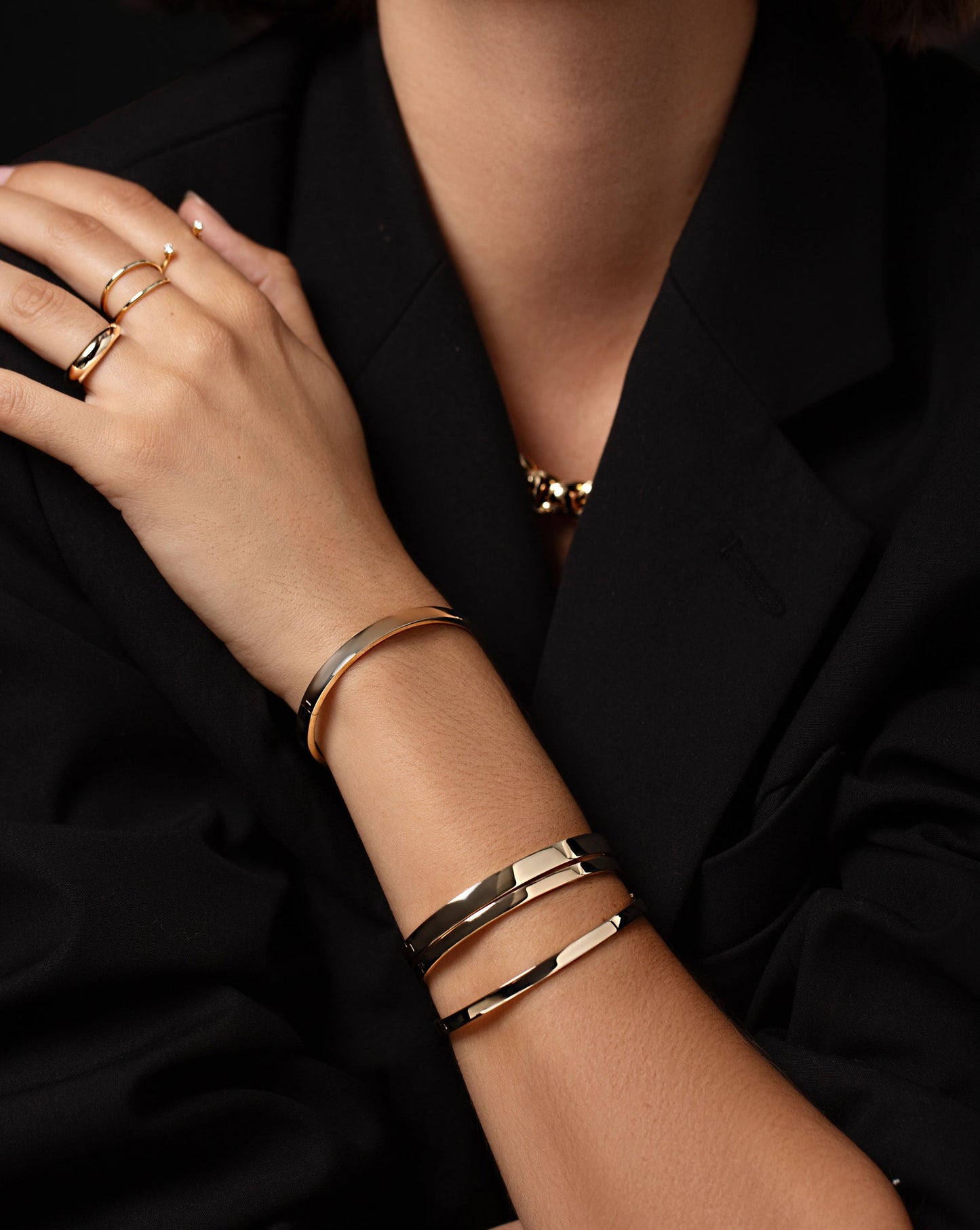 4 Stackable Gold Bangles styled on arrm