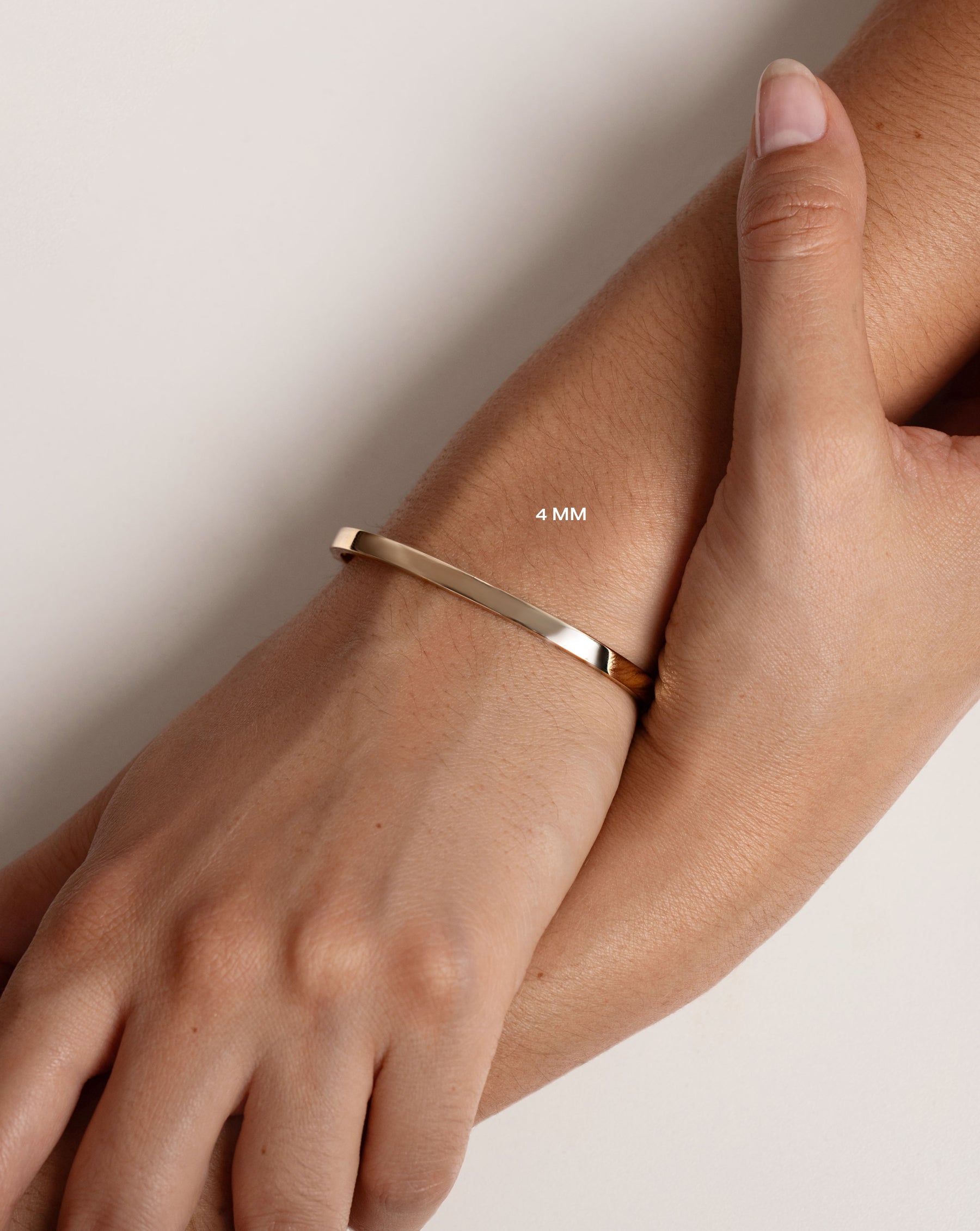 4 mm Stackable Gold Bangle on wrist